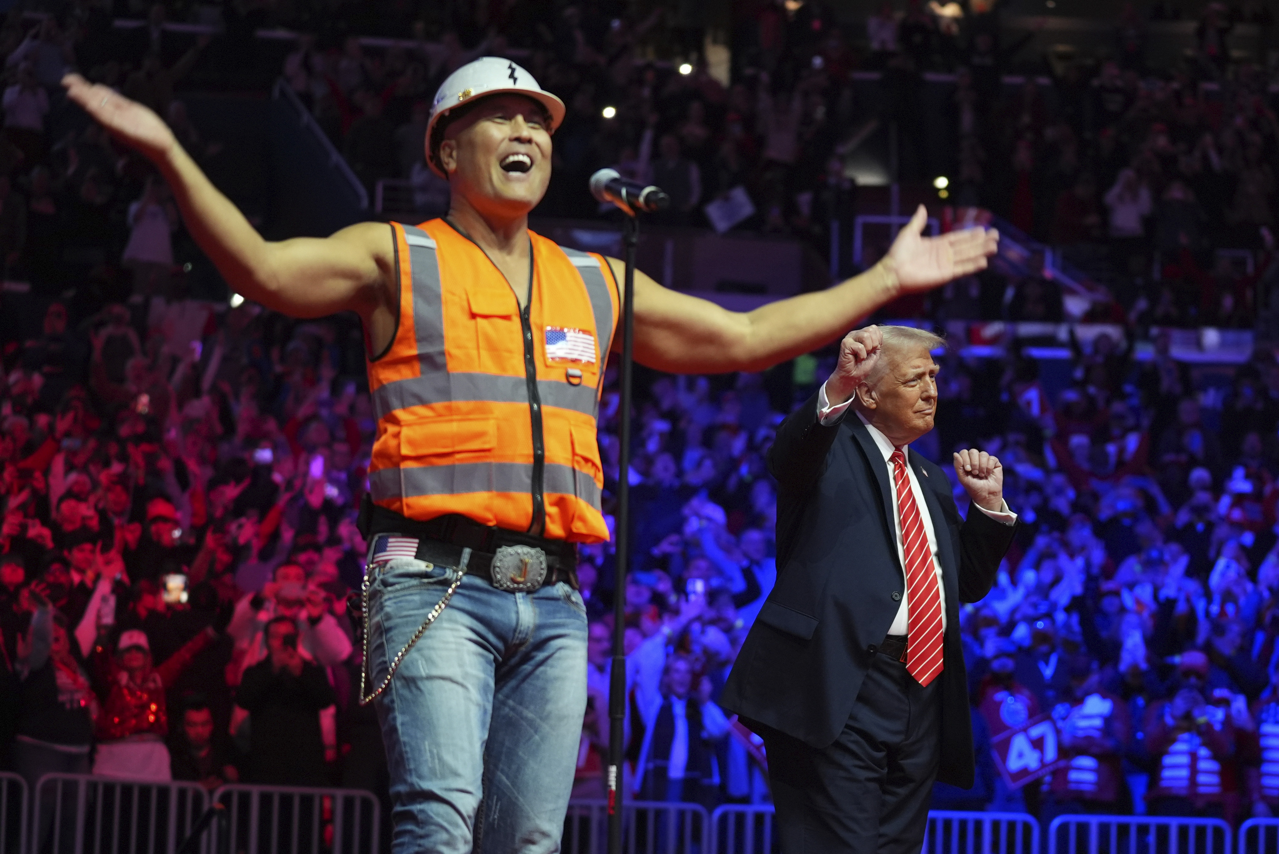 President-elect Donald Trump dances with The Village People at a rally ahead of the 60th Presidential Inauguration