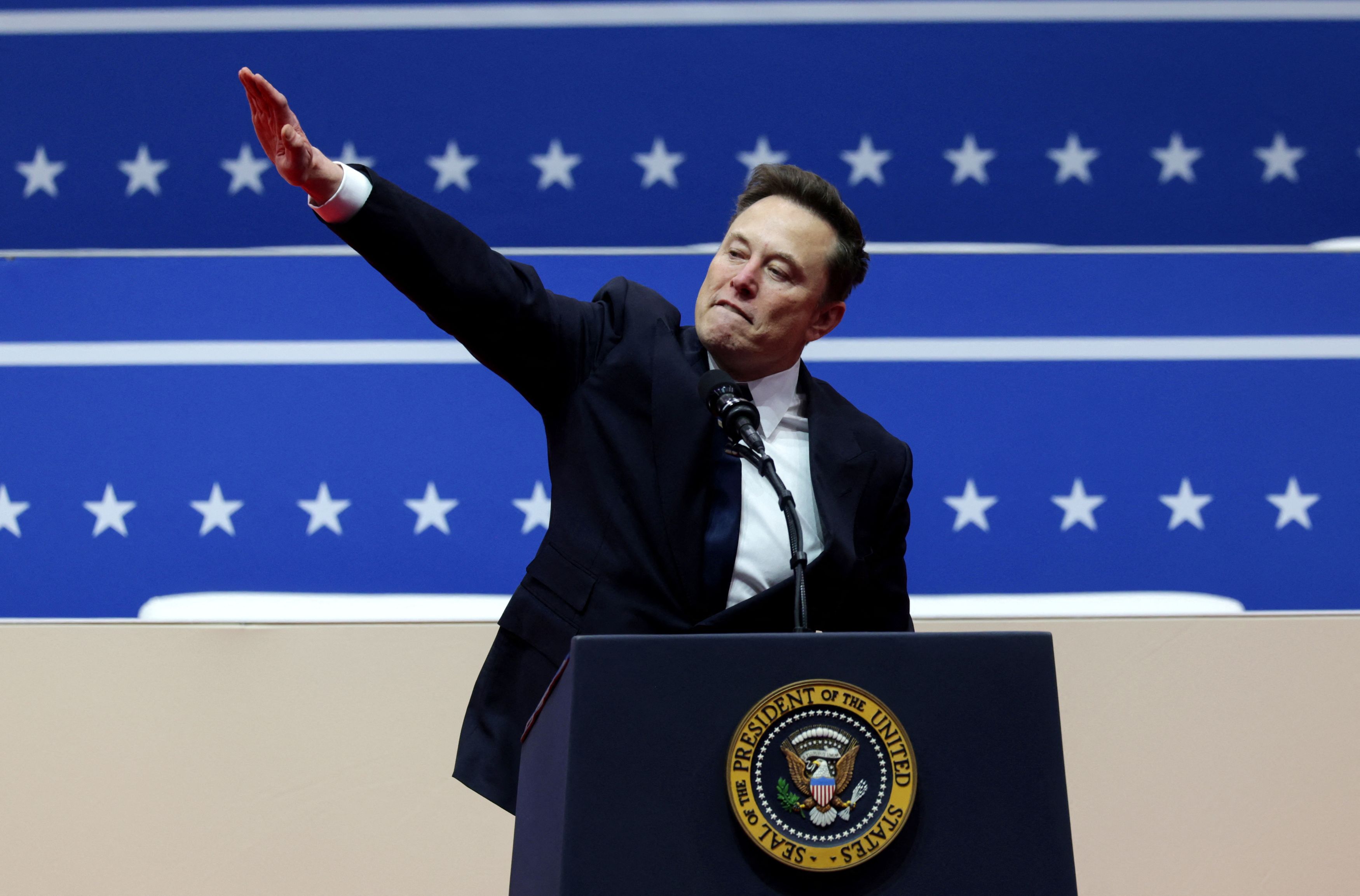 Musk gestures inside Capital One arena on Trump's inauguration day in Washington