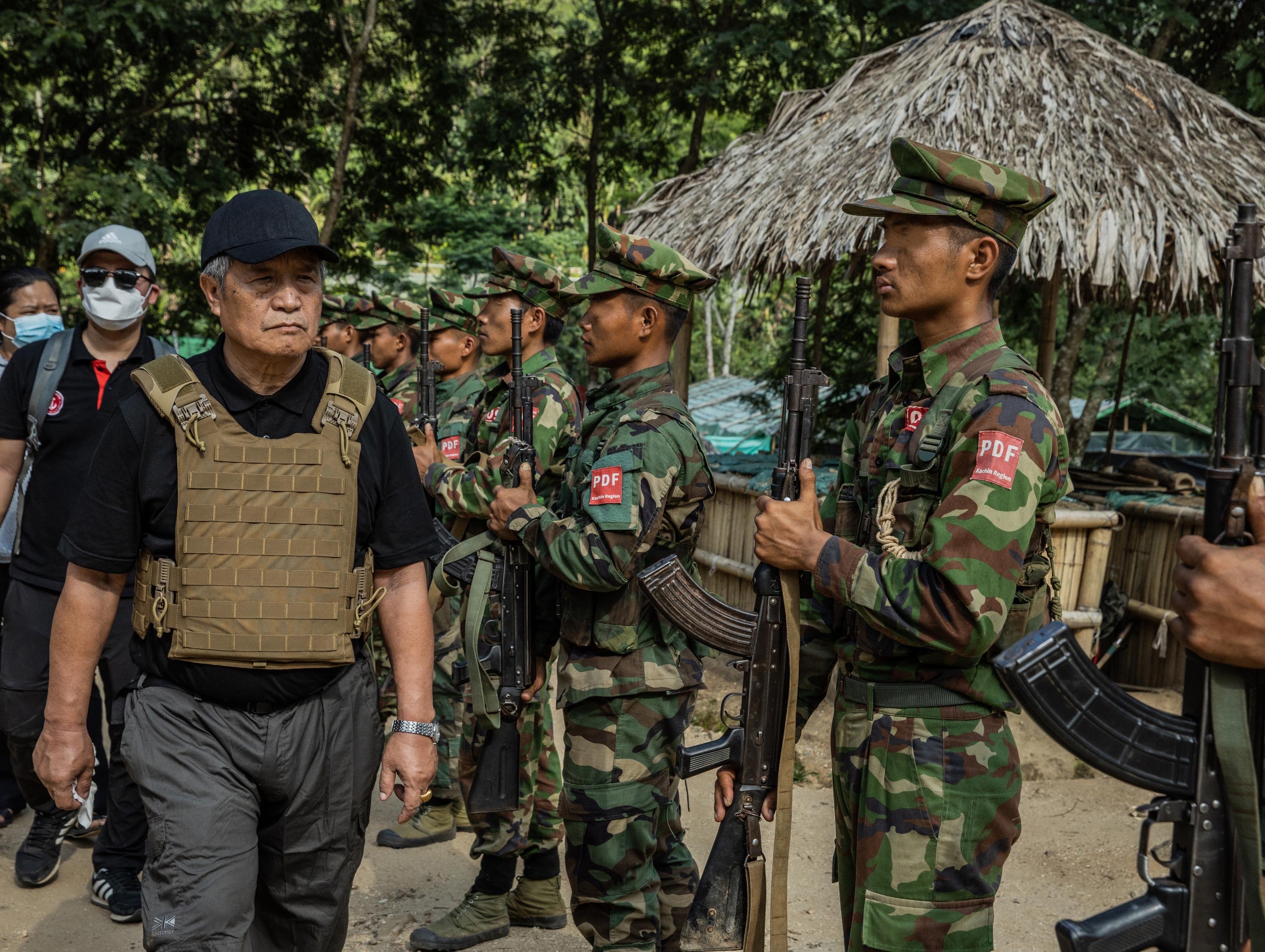 Myanmar’s National Unity Government (NUG) Acting President Duwa Lashi La, left, inspect troops of the People’s Defence Force (PDF) [Courtesy of Duwa Lashi La]