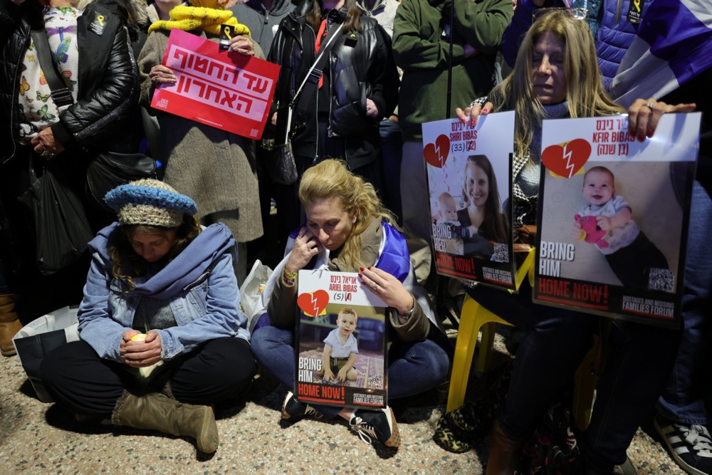 People gather to light candles at the so-called 'Hostages Square' in Tel Aviv.