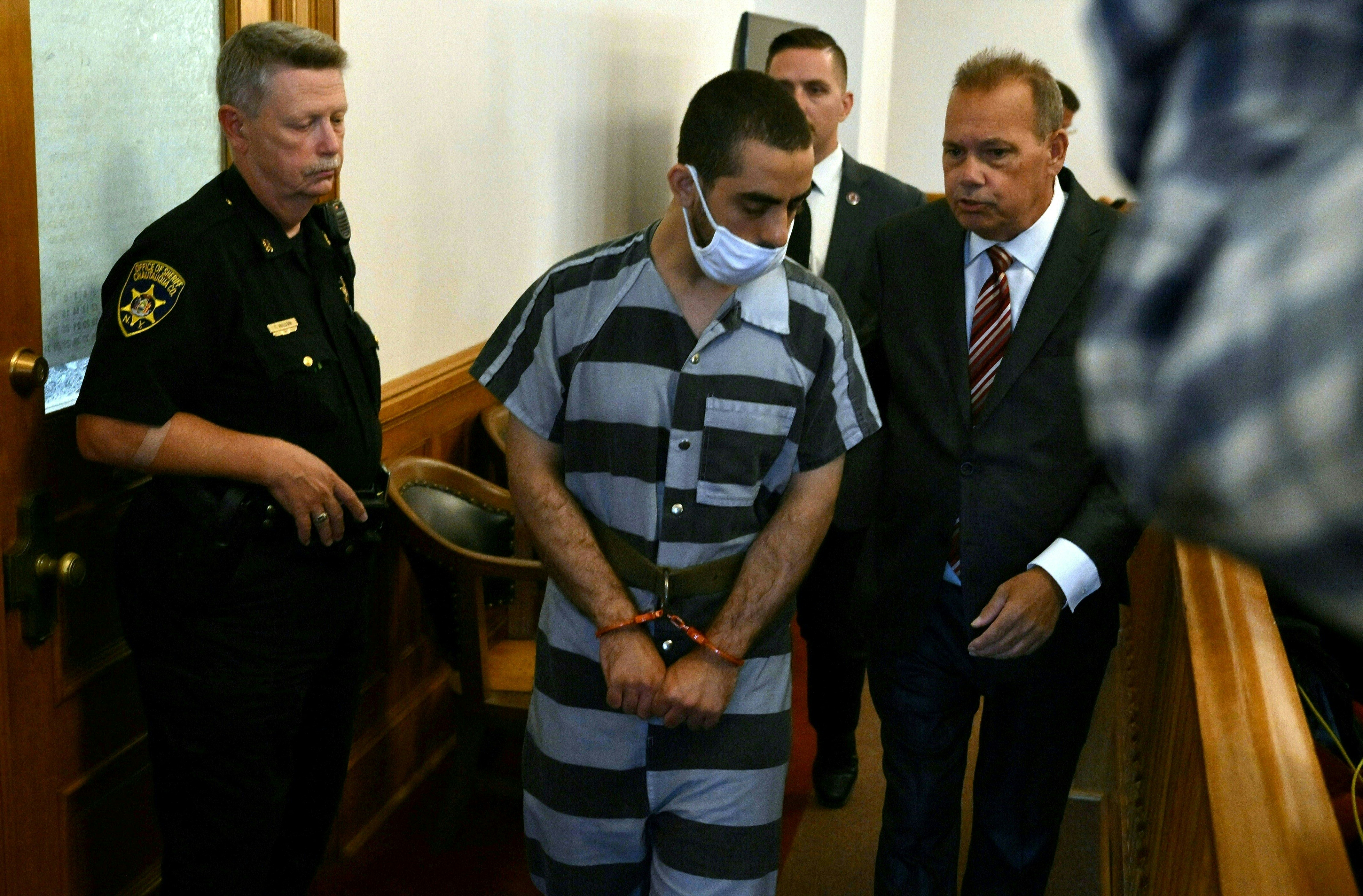 Hadi Matar, the man accused in the attempted murder of British author Salman Rushdie, appears in court for a procedural hearing at Chautauqua County Courthouse in Mayville, New York on August 18, 2022. Matar has pleaded not guilty to attempted murder charges after being accused of stabbing British author Salman Rushdie multiple times on stage during a literary event at the Chautauqua Institution. The severely injured author is recovering and showing signs of his "feisty and defiant" self, family and friends said, after the shocking assault left him on a ventilator with multiple stab wounds on August 12, 2022. (Photo by ANGELA WEISS / AFP)