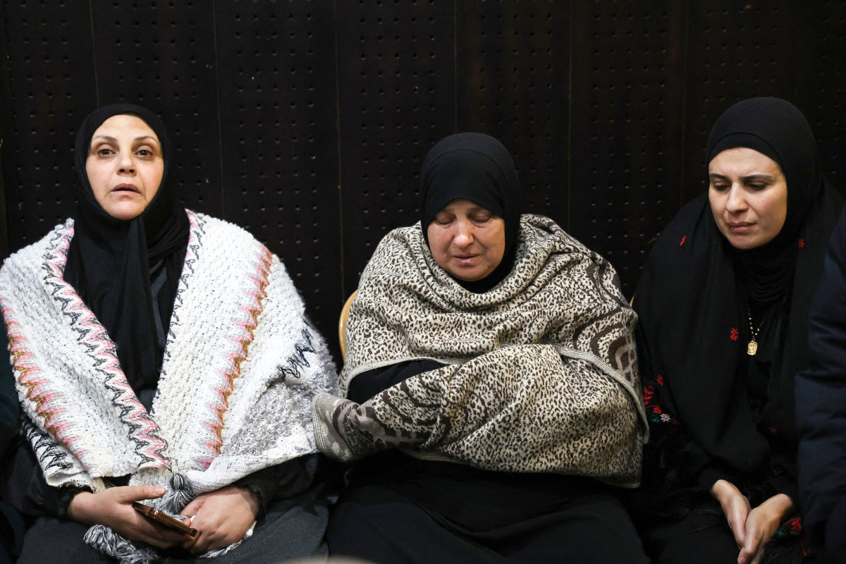 Palestinian families react after Israel delays release of prisoners, scheduled to be released in the seventh captive-prisoner exchange, in the occupied West Bank city of Ramallah, February 23, 2025 [Zain Jaafar/AFP]