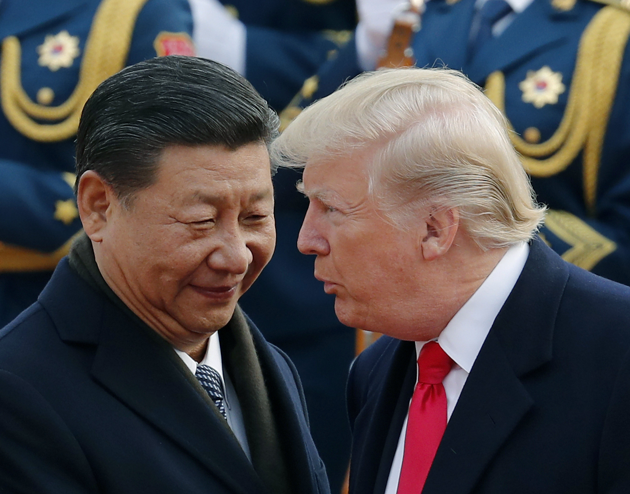US President Donald Trump chats with Chinese President Xi Jinping.