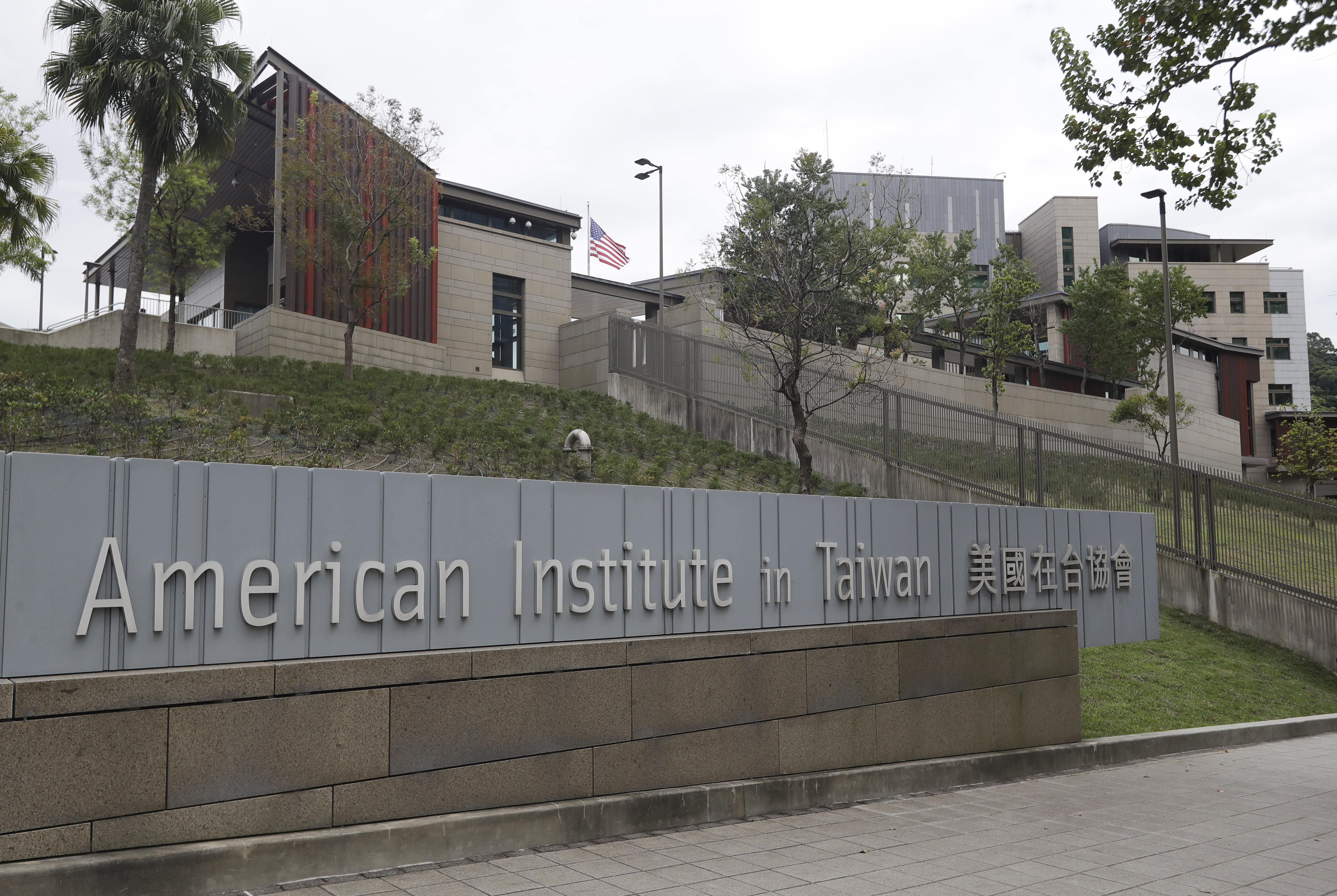 A US flag flutters at American Institute in Taiwan, or AIT in Taipei, Taiwan, Wednesday, Nov. 10, 2021. (AP Photo/Chiang Ying-ying, File)