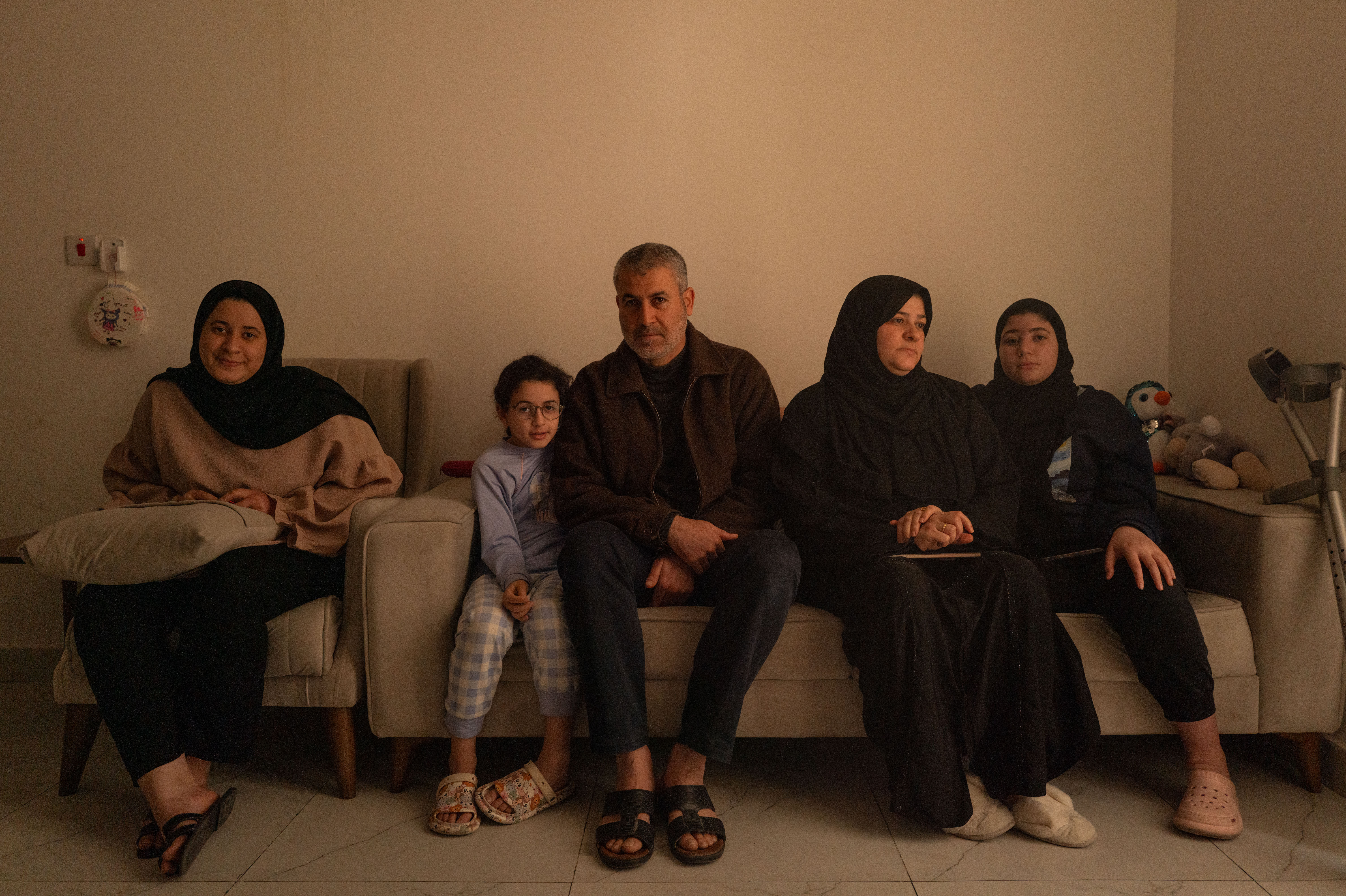 The al-Agha family sitting together.