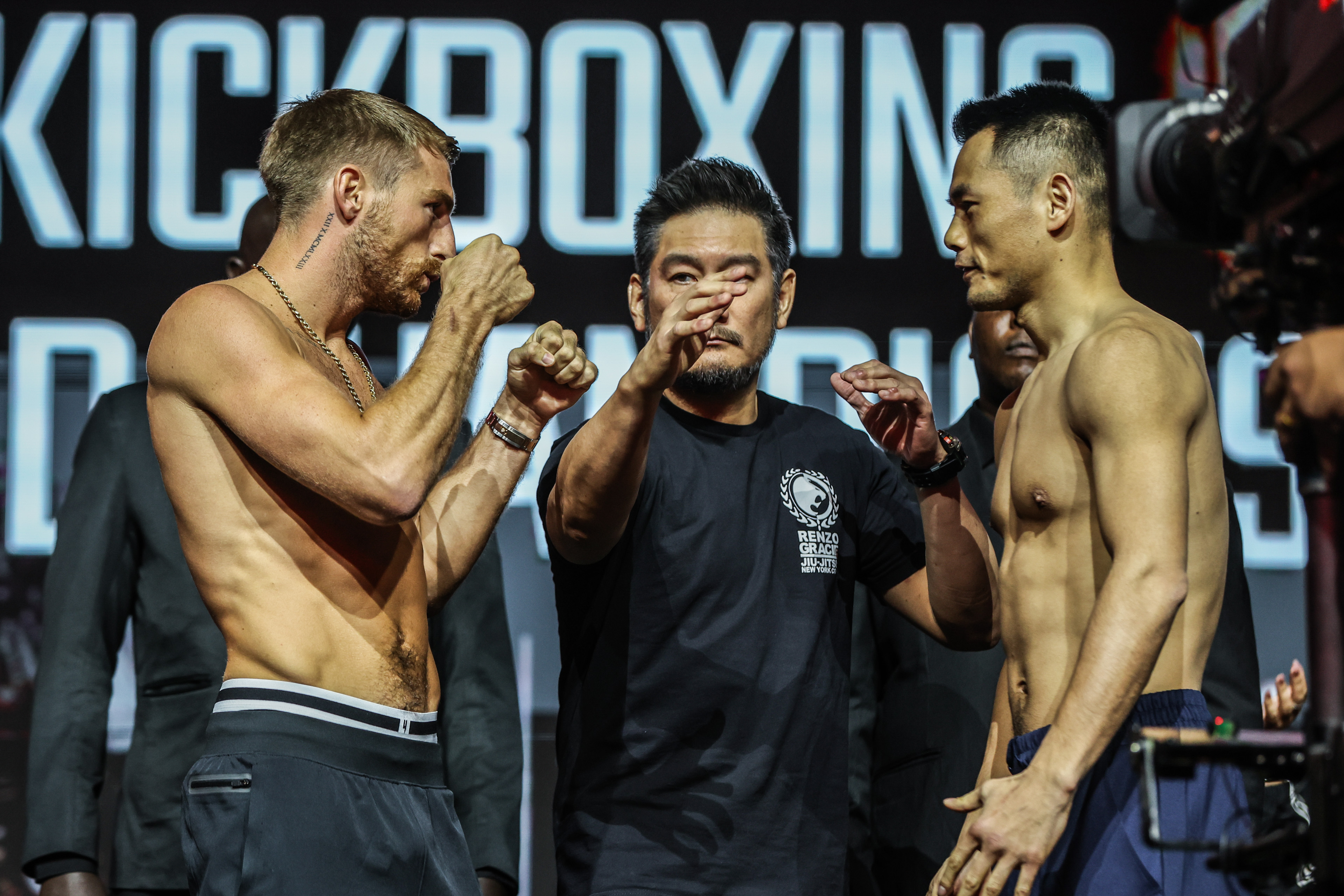 MMA fighters face off at weigh-in.