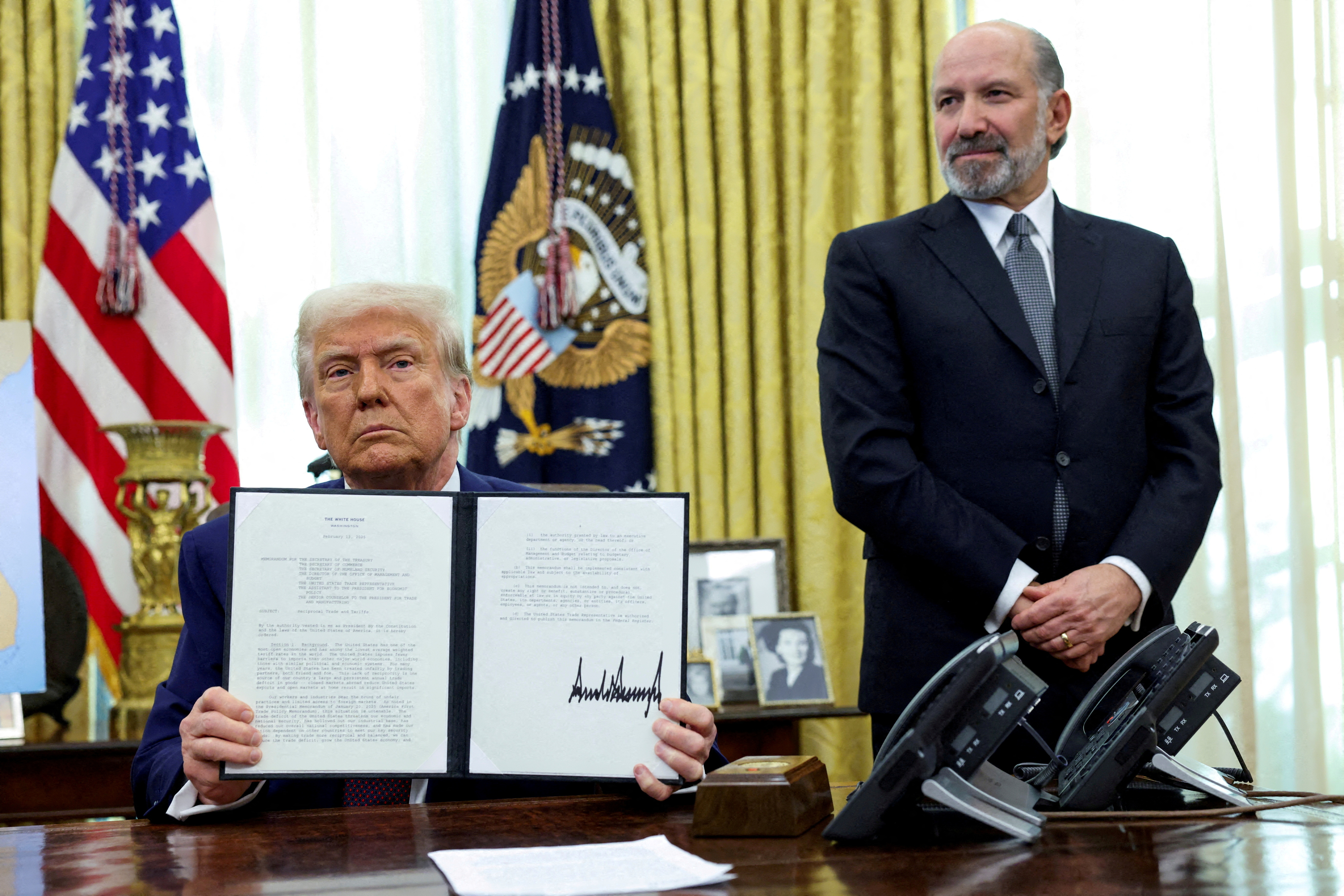 U.S. President Donald Trump holds an executive order about tariffs increase