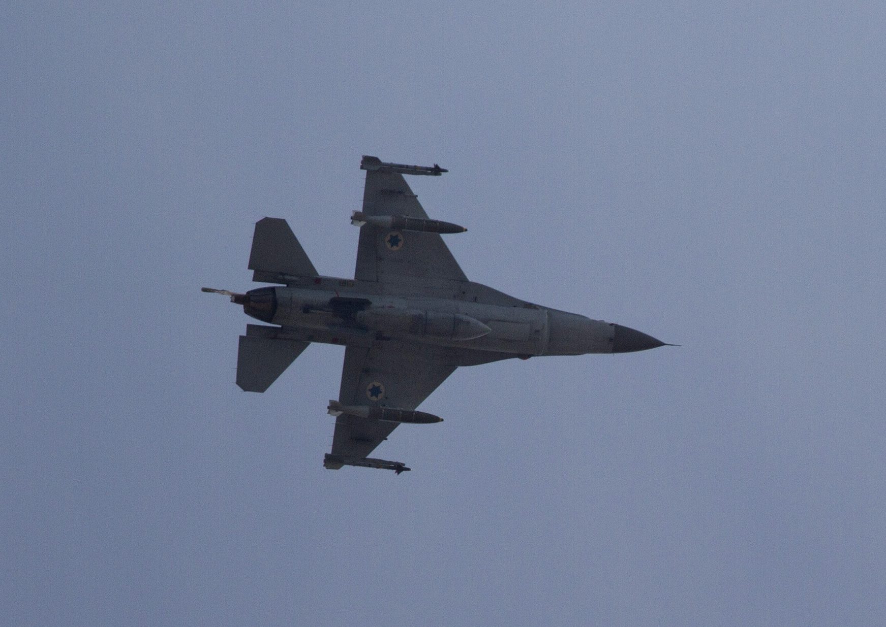 FILE - In this Nov. 18, 2012 file photograph, an Israeli F-16 jet fighter flies near the city of Ashdod, Israel. An Israeli air attack reportedly staged in Syria this week may be a sign of things to come. Israeli military officials appear to have concluded that the risks in attacking Syria are worth taking when compared to the dangers of allowing sophisticated weapons to reach Hezbollah guerrillas in neighboring Lebanon. (AP Photo/Ariel Schalit, File)