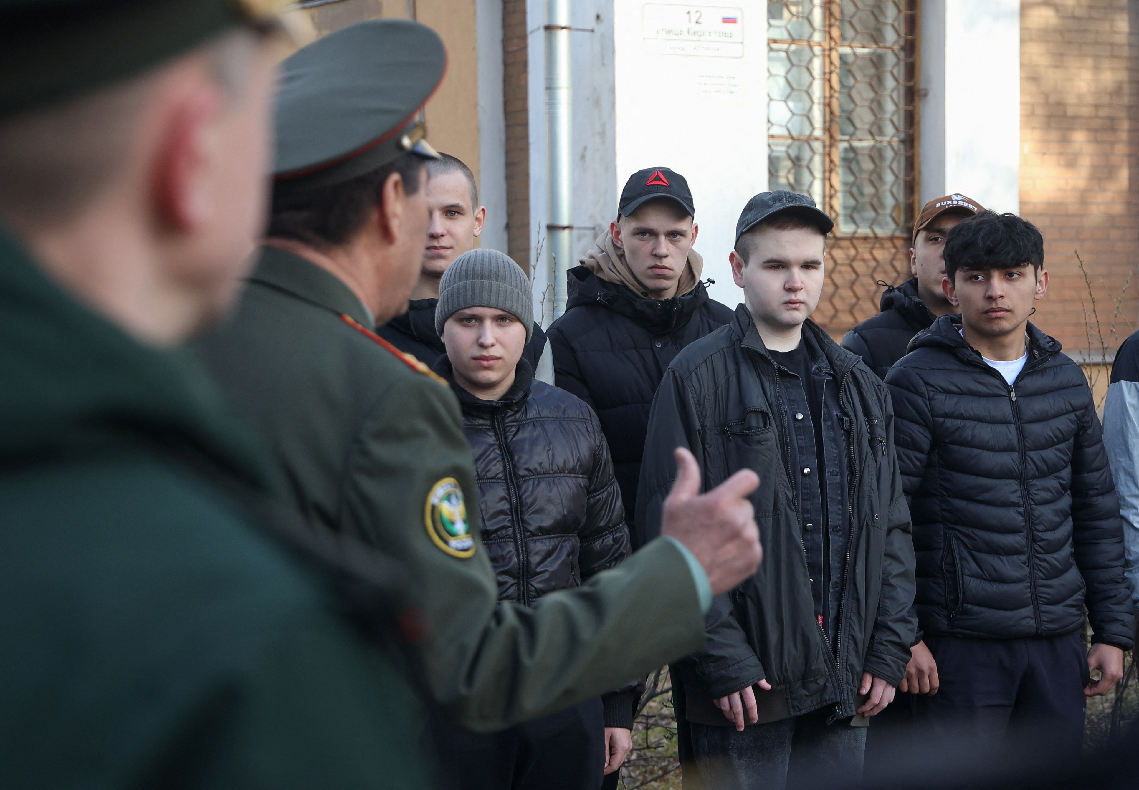 Russian conscripts called up for military service line up during a ceremony before their departure for garrisons from a recruitment headquarters in Gatchina in the Leningrad region, Russia, April 14, 2025. REUTERS/Anastasia Barashkova