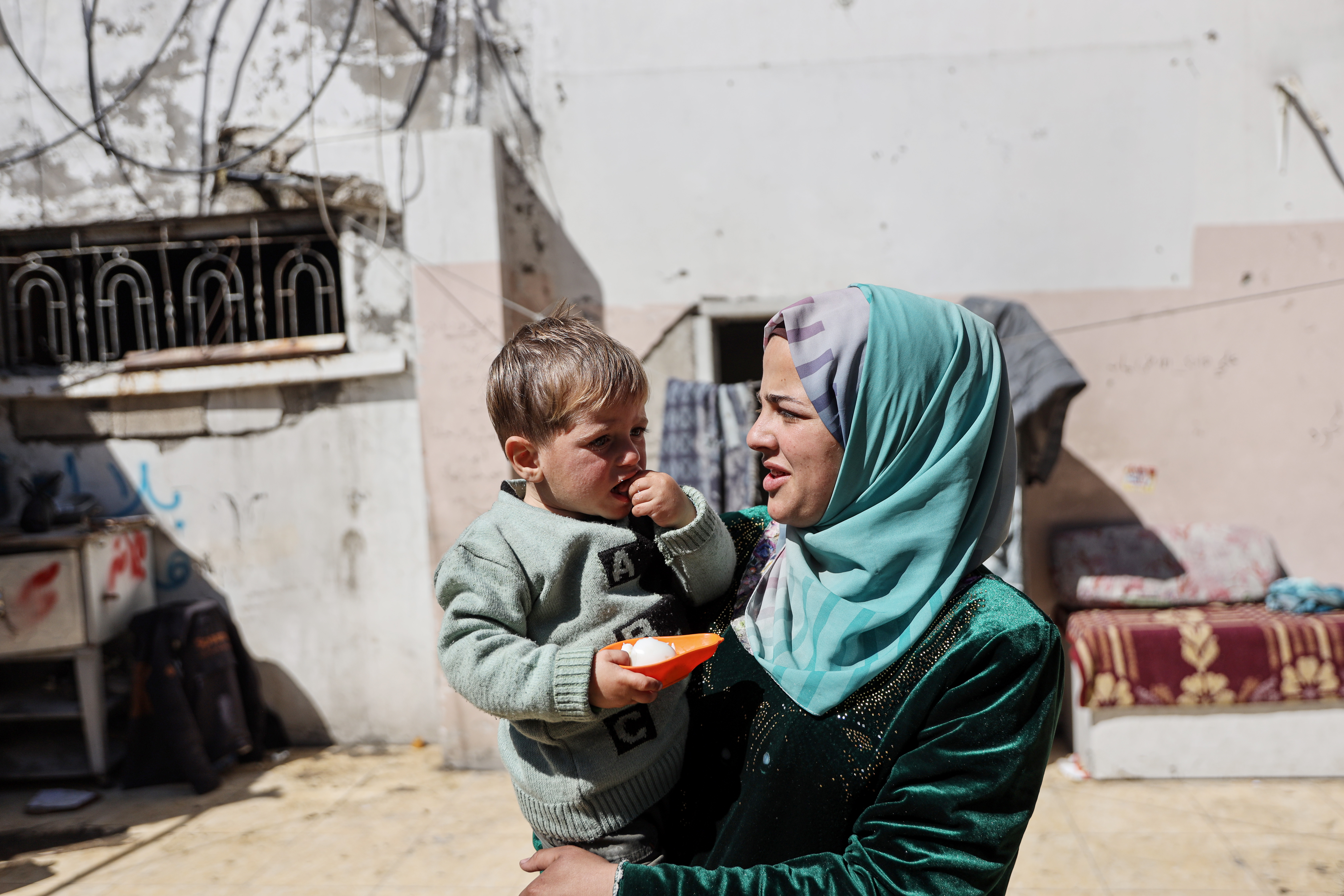 Mohammed with Islam, who helped her mother take care of him for more than a year