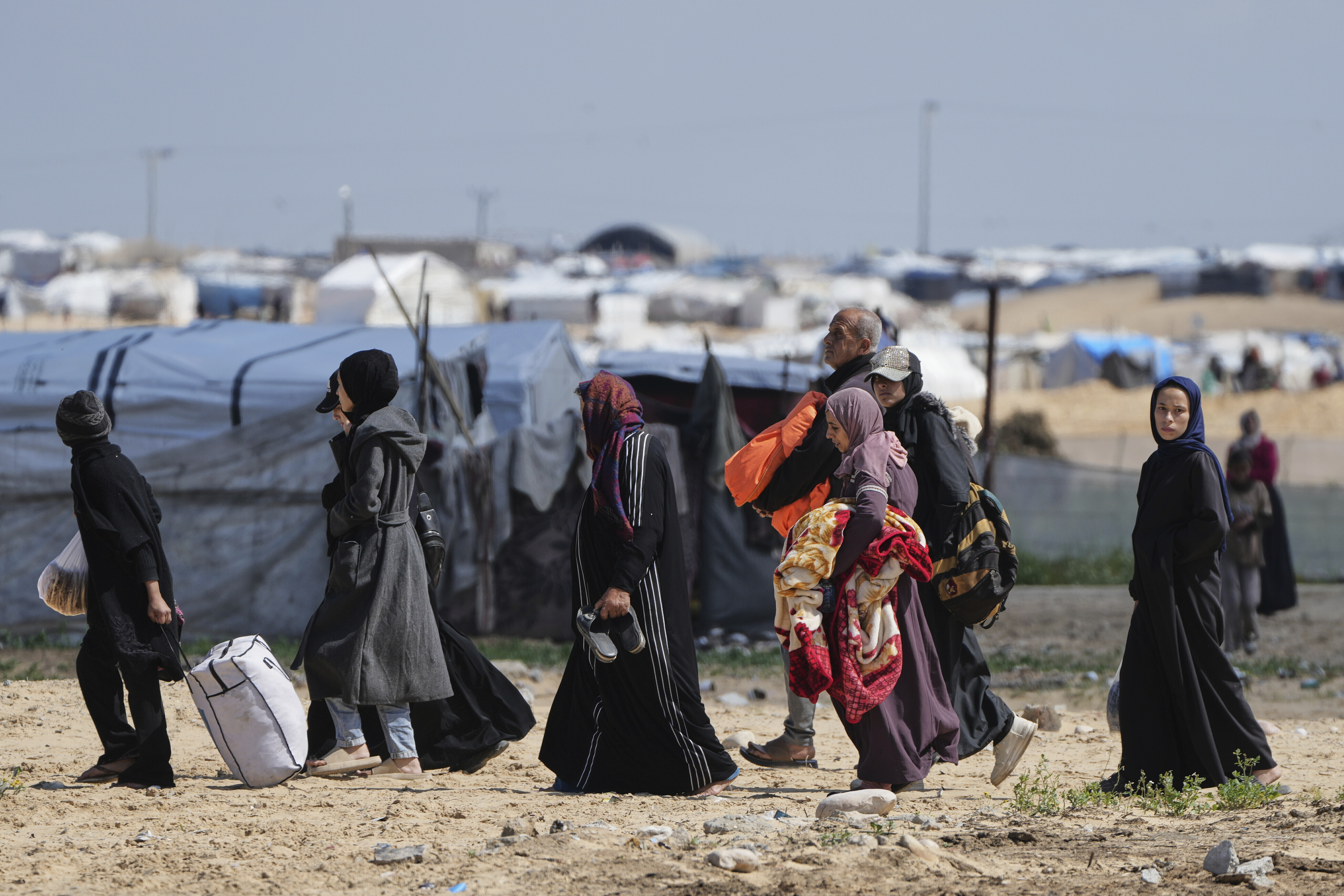 Families flee with few belongings as Gaza's shelters overflow, leaving many without tents or essential supplies.