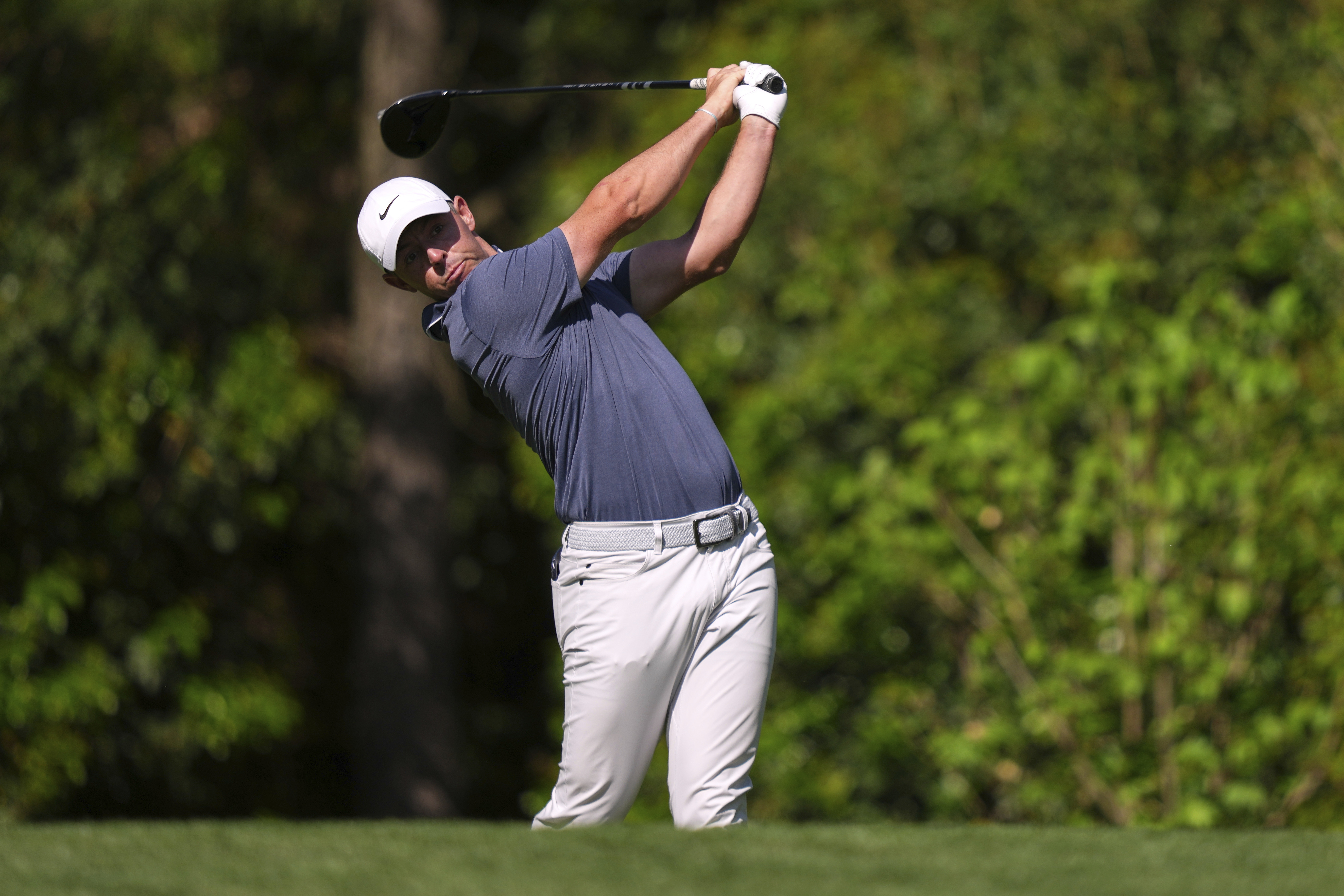 Rory McIlroy, of Northern Ireland, watches his tee shot on the 11th hole during the final round at the Masters golf tournament, Sunday, April 13, 2025, in Augusta, Georgia, US