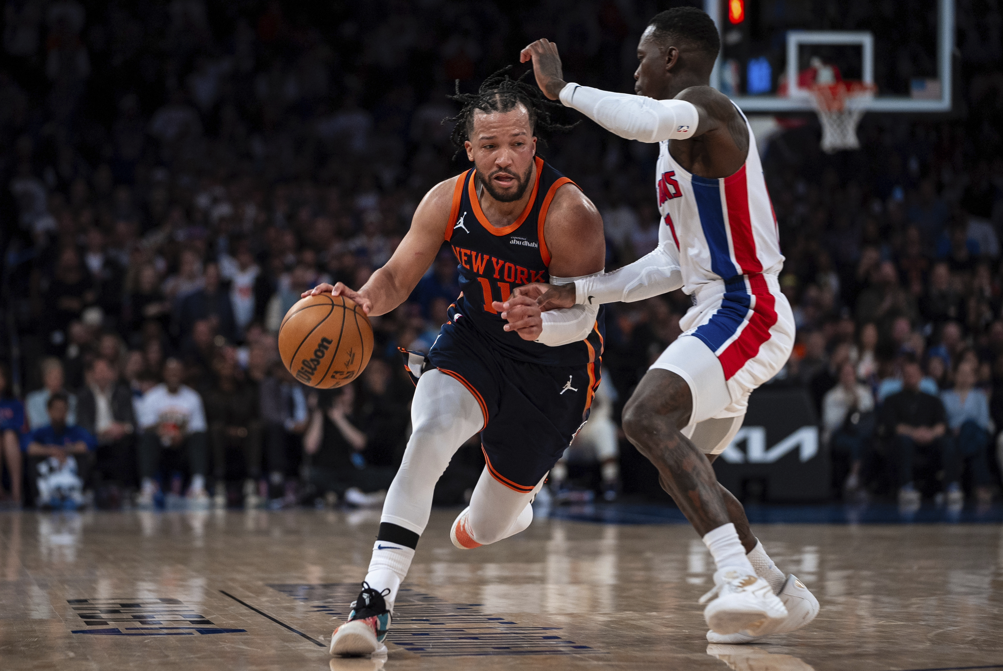 New York Knicks guard Jalen Brunson (#11), who led all scorers with 37 points, drives towards the basket against a Pistons defender in the fourth quarter of Game 2 on April 21, 2025