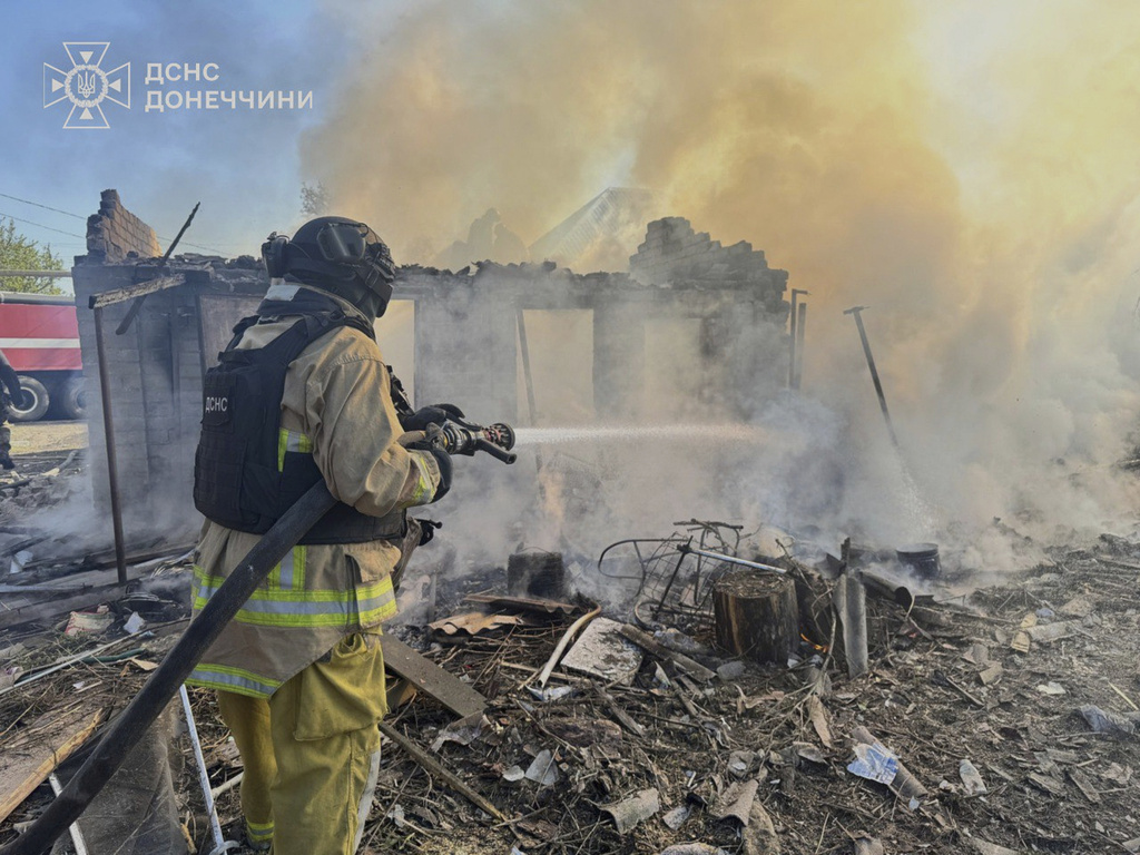 A firefighter puts out a fire at ruined houses following Russia’s air raid in the Donetsk region, Ukraine, April 28, 2025 [Ukrainian Emergency Service via AP]