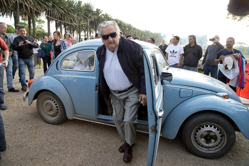 Uruguay’s former President Jose Mujica arrives in his famous Volkswagen Beetle car to cast his vote in Montevideo, Uruguay, on October 26, 2014