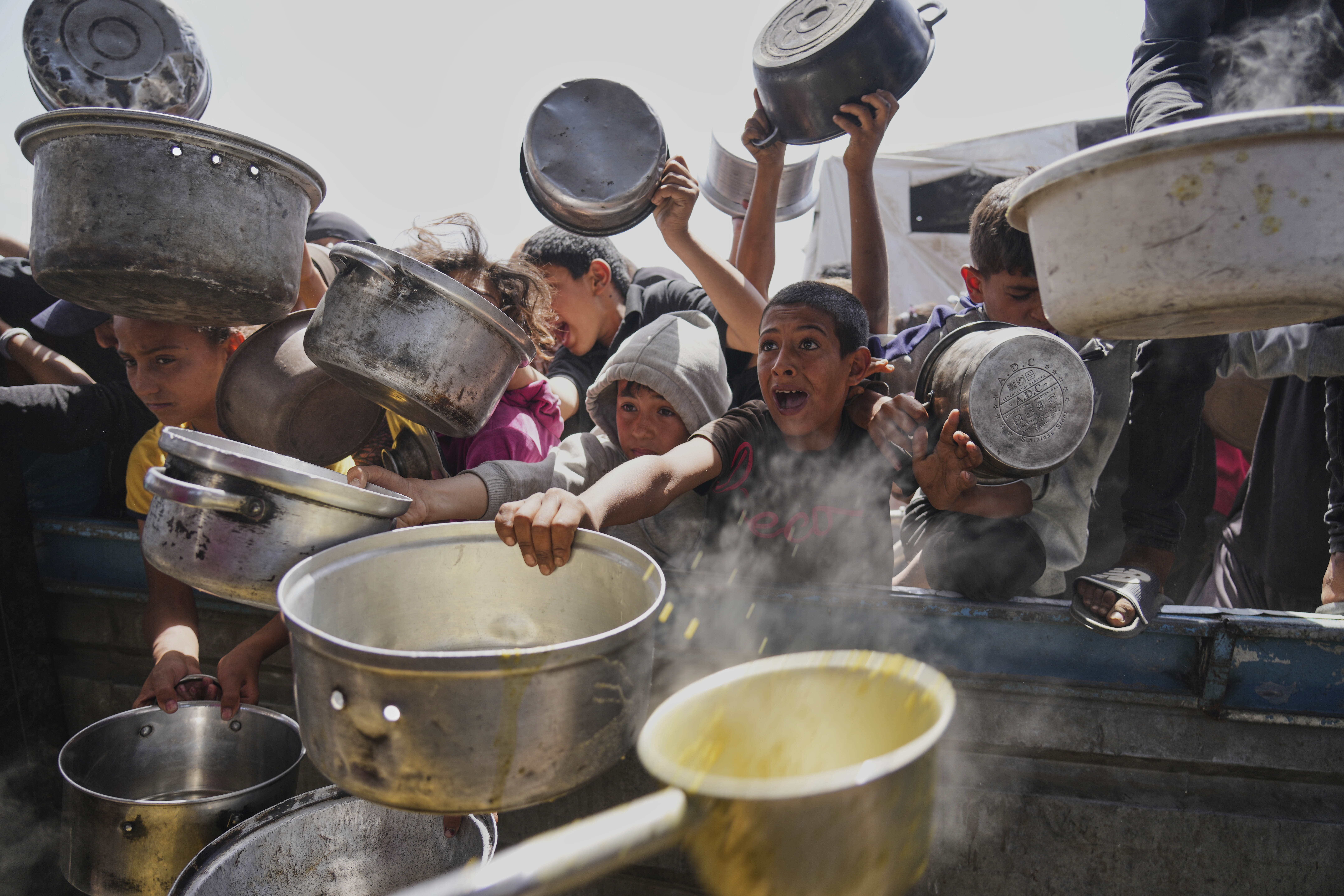 Palestinian children cry for food in Gaza