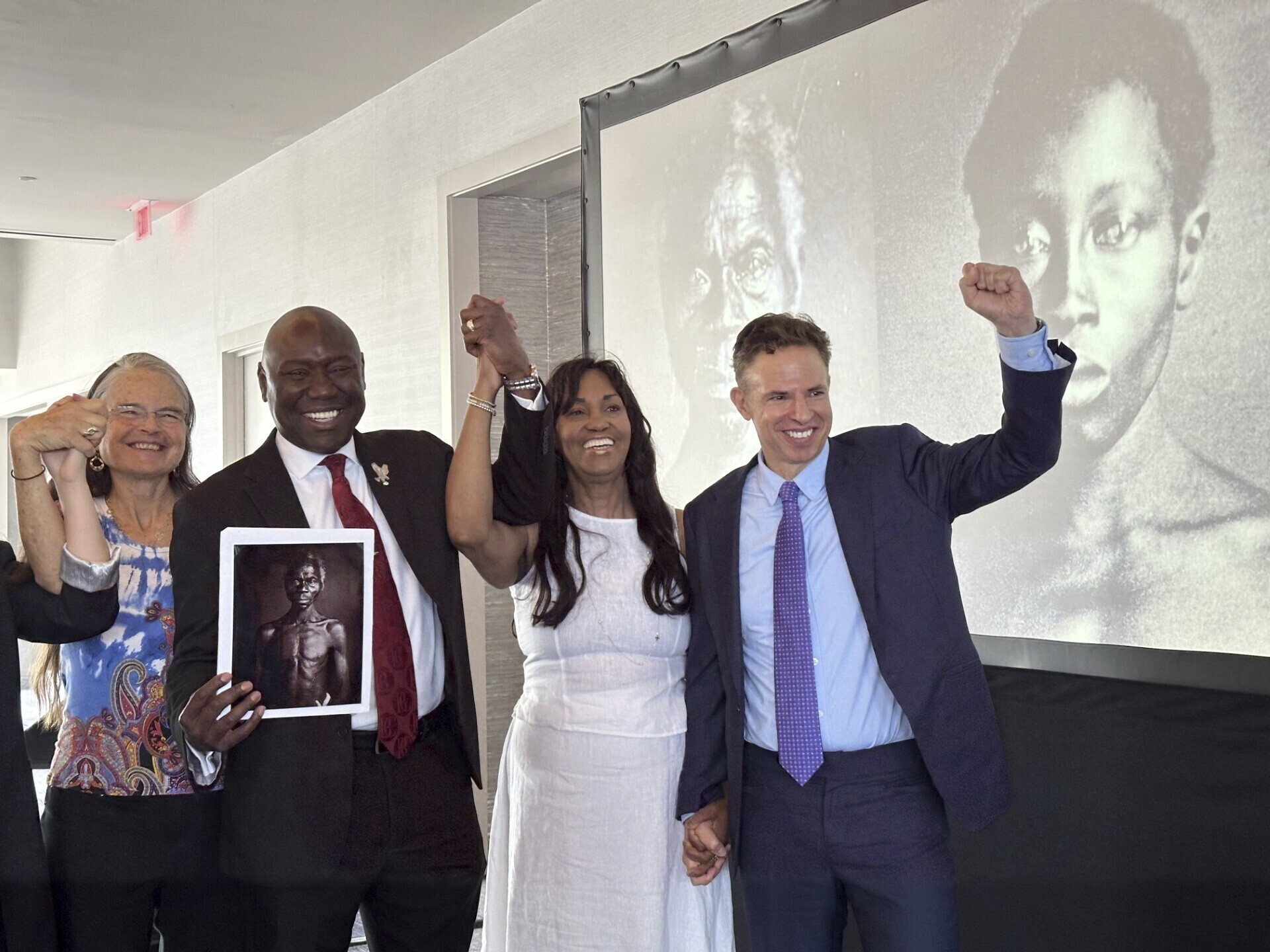 Susanna Moore (left), a descendant of Louis Agassiz, celebrates with Tamara Lanier and lawyers Ben Crump and Josh Koskoff March 28 in Boston, Massachusetts