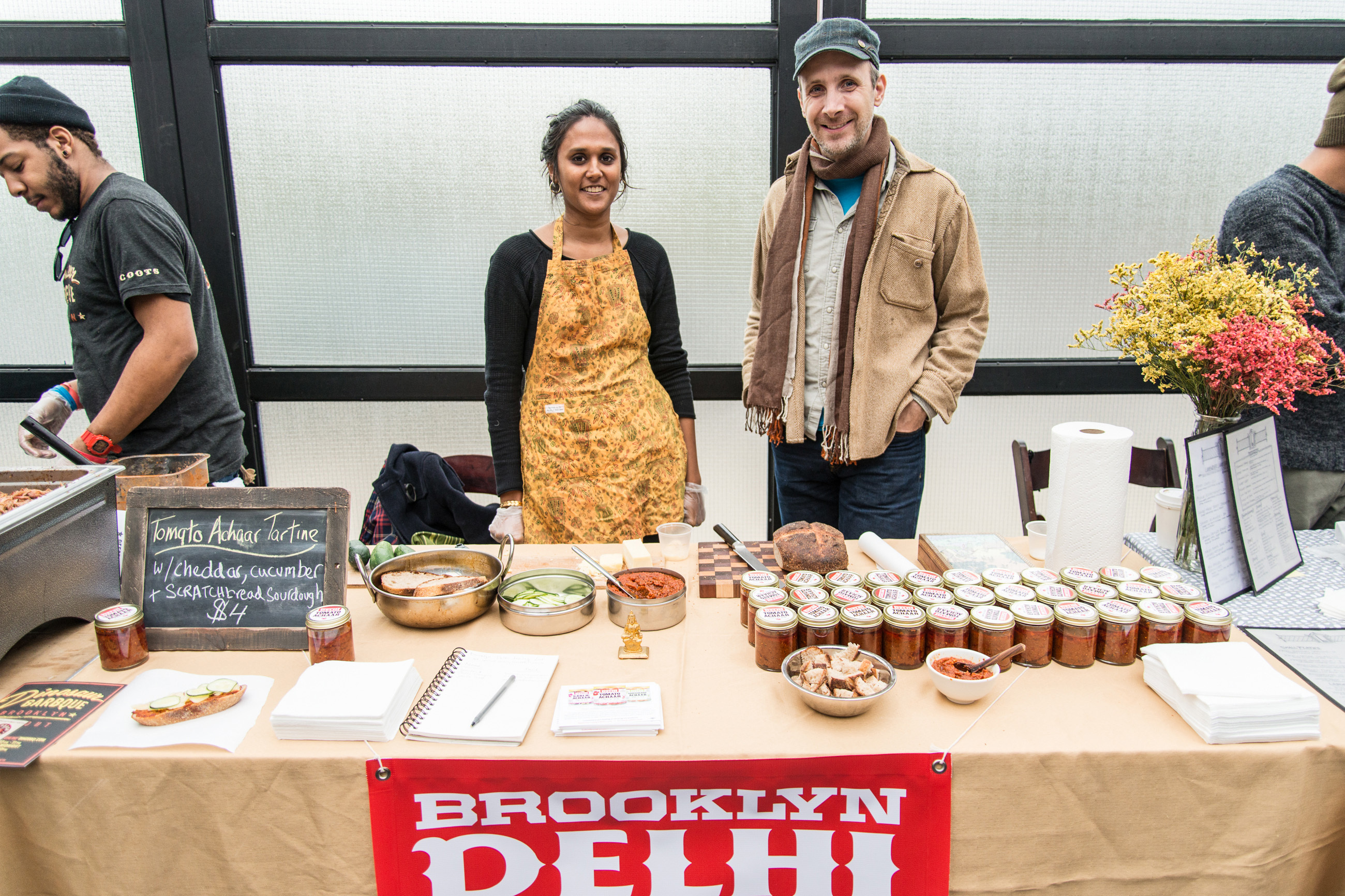 Brooklyn Delhi cofounders Chitra Agrawal & Ben Garthus brace for a rise in expenses as the business imports nearly 70 percent of its ingredients from outside the United States [Brooklyn Delhi]