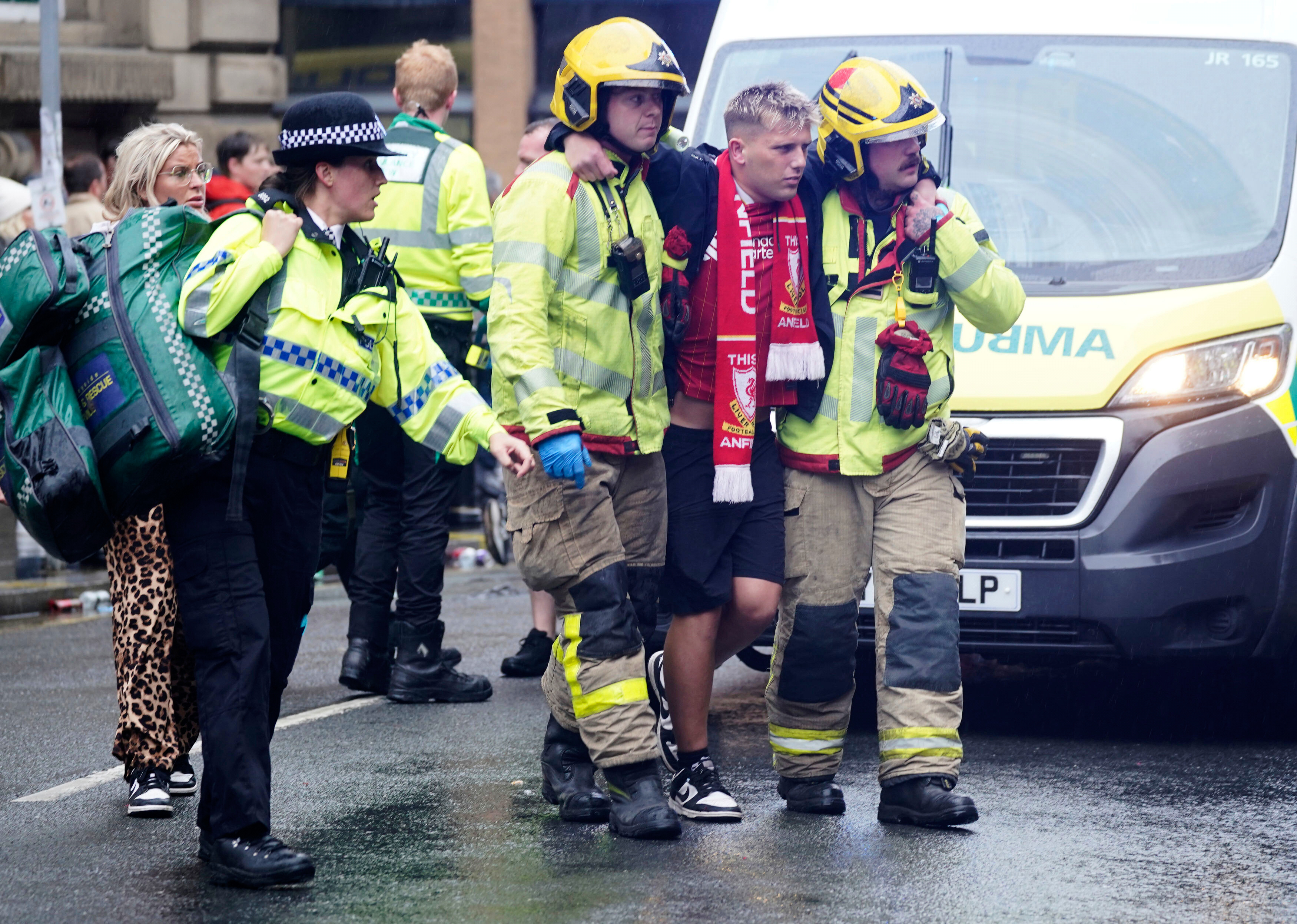 Police and emergency personnel deal with an incident on Water Street near the Liver Building in Liverpool after a car collided with pedestrians during the Premier League winners parade, in Liverpool, England