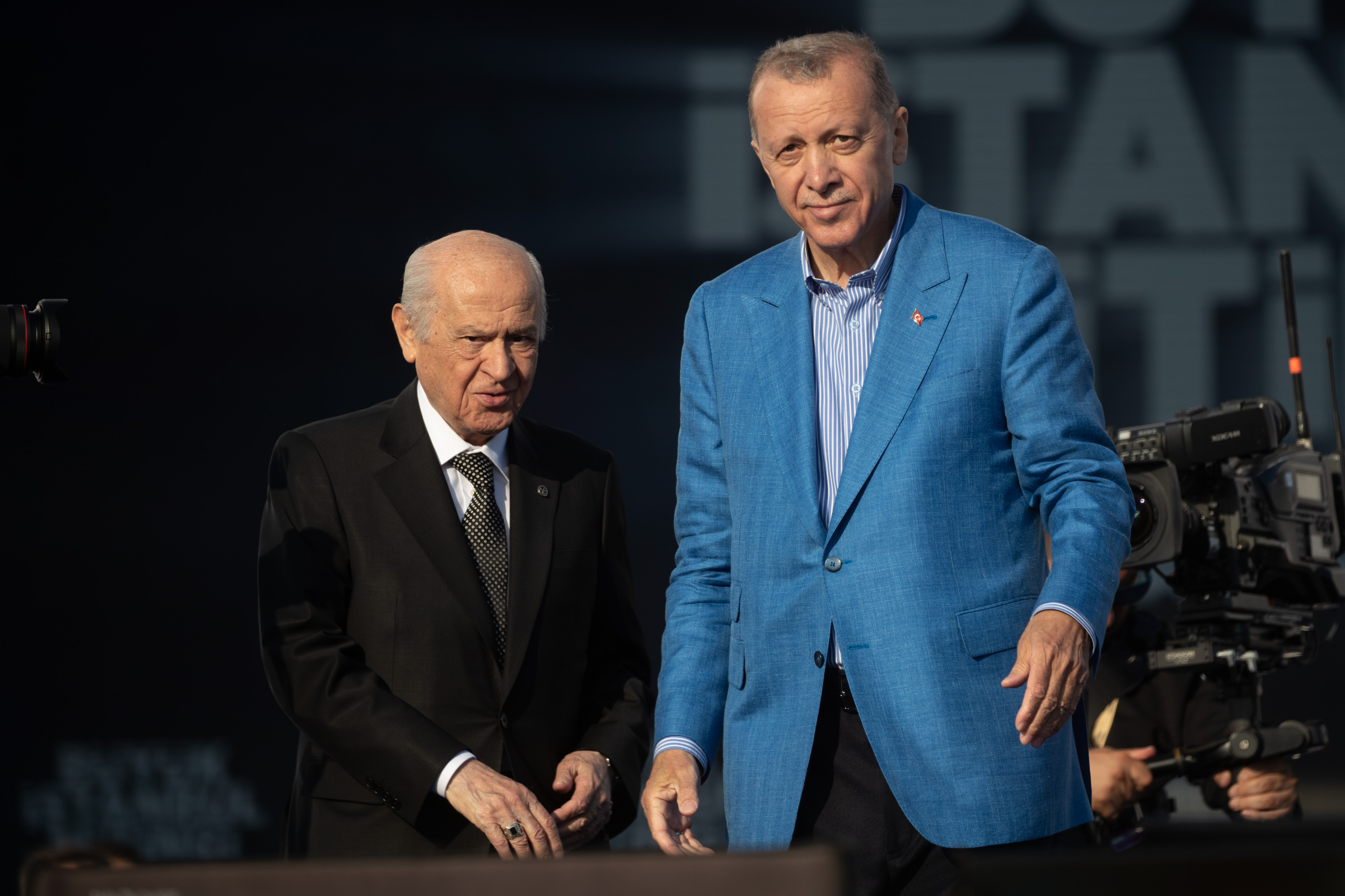 ISTANBUL, TURKEY - MAY 07: Turkey's President Recep Tayyip Erdogan and Devlet Bahceli, leader of the Nationalist Movement Party (MHP), greet supporters at a rally while campaigning for the presidential election on May 07, 2023 in Istanbul, Turkey. On May 14th, Turkey’s President Erdogan will face his biggest electoral test as voters head to the polls in the country’s general election. Erdogan has been in power for more than two decades, first as prime minister and then as president, but his popularity has taken a hit recently due to Turkey’s ongoing economic crisis and his government’s handling of series of devastating earthquakes that struck the country’s southeast in early February, killing more than 50,000 people. Meanwhile, the political opposition has united around one candidate, Kemal Kilicdaroglu, who some polls indicate has an edge. (Photo by Burak Kara/Getty Images)