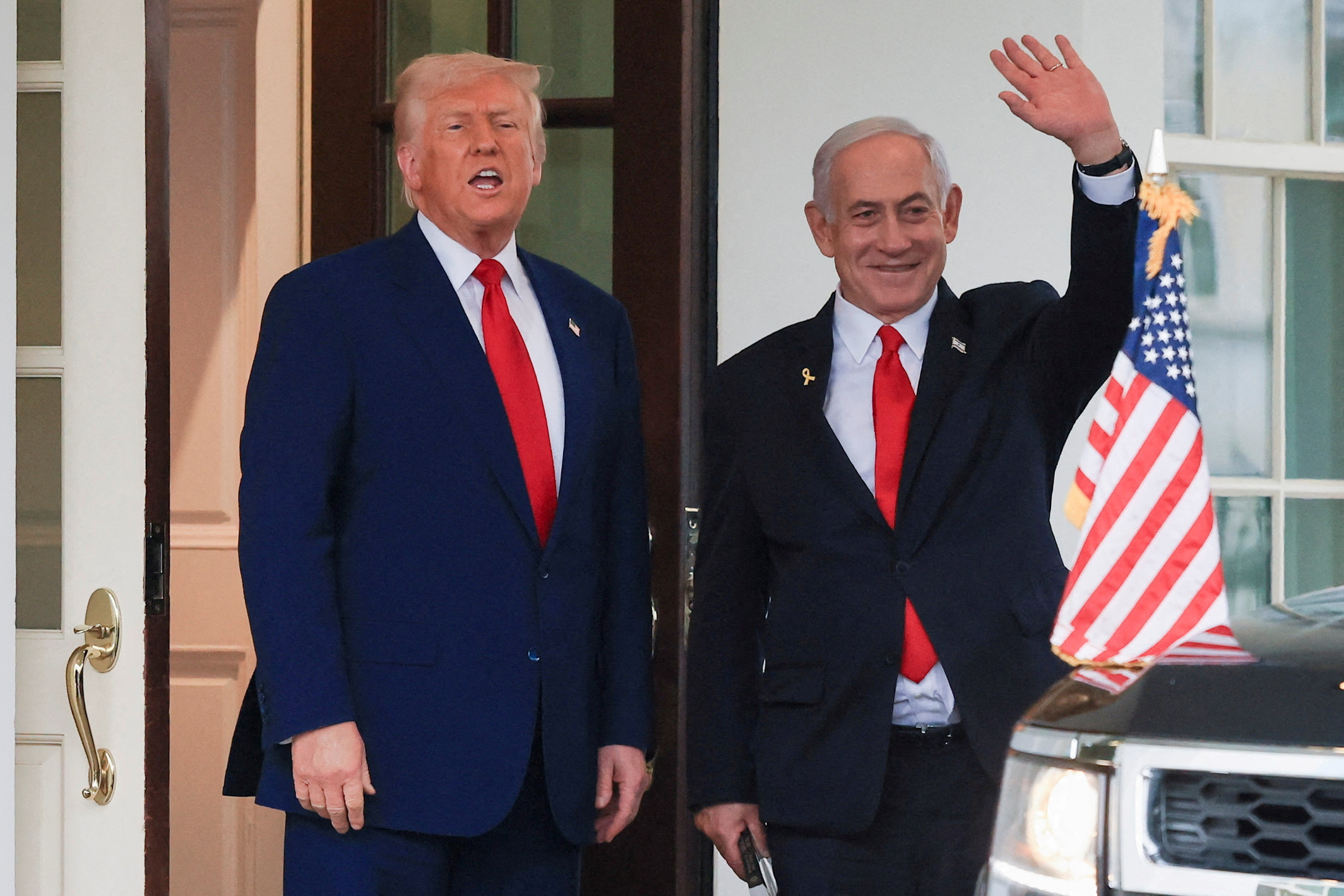 FILE PHOTO: U.S. President Donald Trump speaks as Israeli Prime Minister Benjamin Netanyahu waves following a meeting in the White House, in Washington, U.S., April 7, 2025. REUTERS/Kevin Mohatt/File Photo