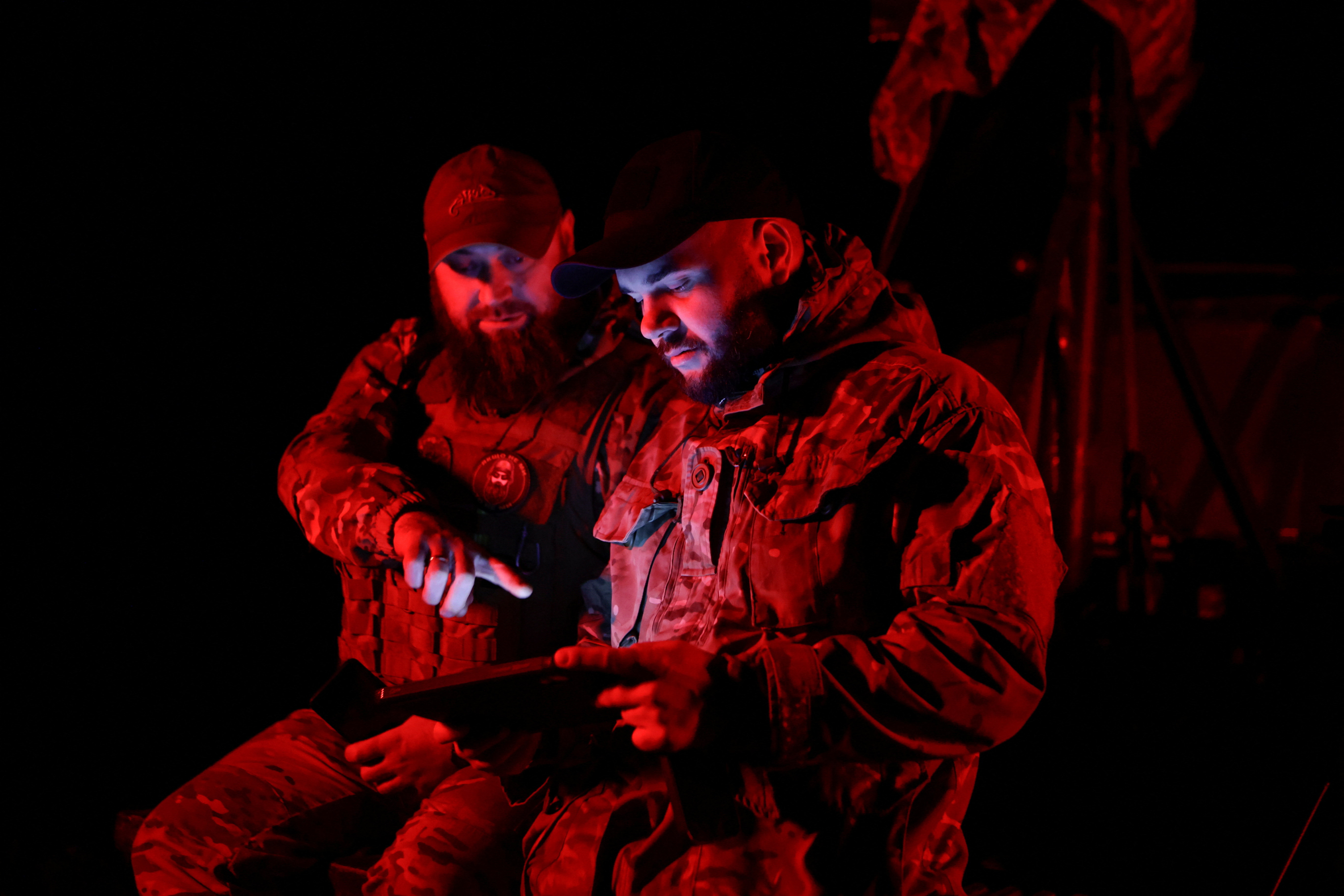 Servicemen from the mobile air defence unit of the 115th Separate Mechanized Brigade of the Ukrainian Armed Forces check a combat application for presence of Russian drones during an overnight shift, amid Russia's attack on Ukraine, in Kharkiv Region, Ukraine June 1, 2025. REUTERS/Sofiia Gatilova