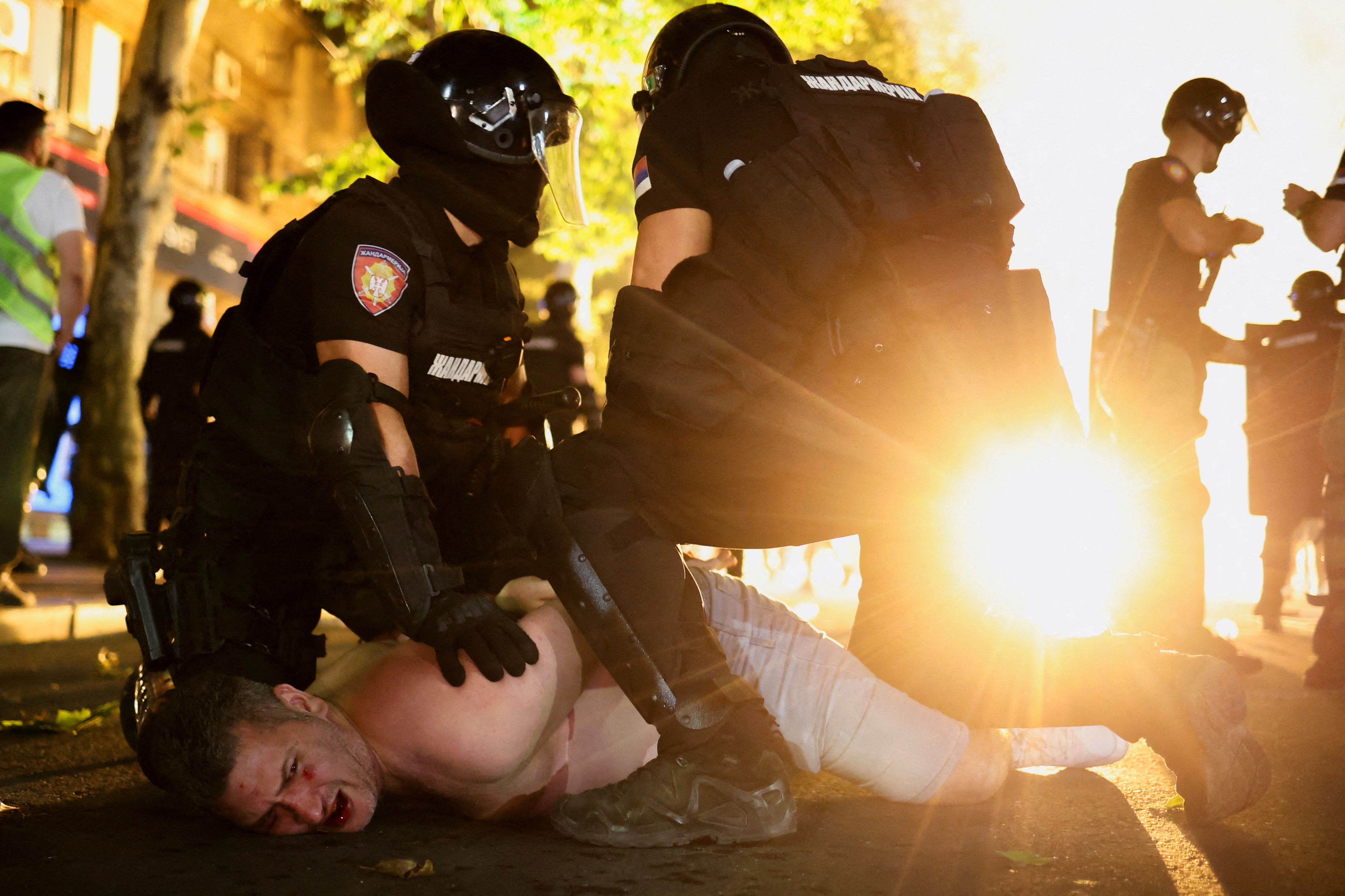 Anti-government protesters clash with riot police in Serbia