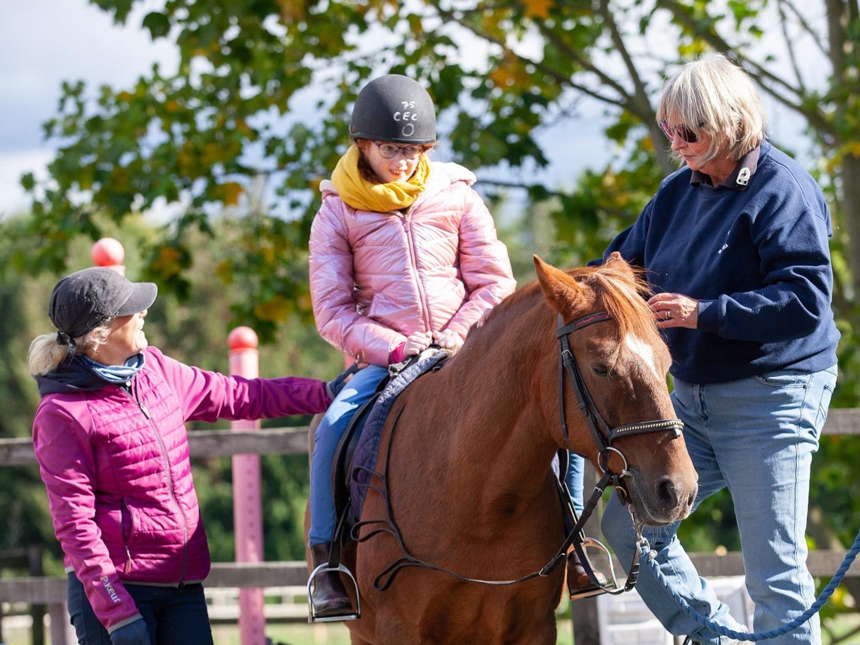 Chloe, who lives with Cohen syndrome, has learned to walk three times. She attends college three days a week and enjoys riding [Courtesy of Catherine Ann Reid]