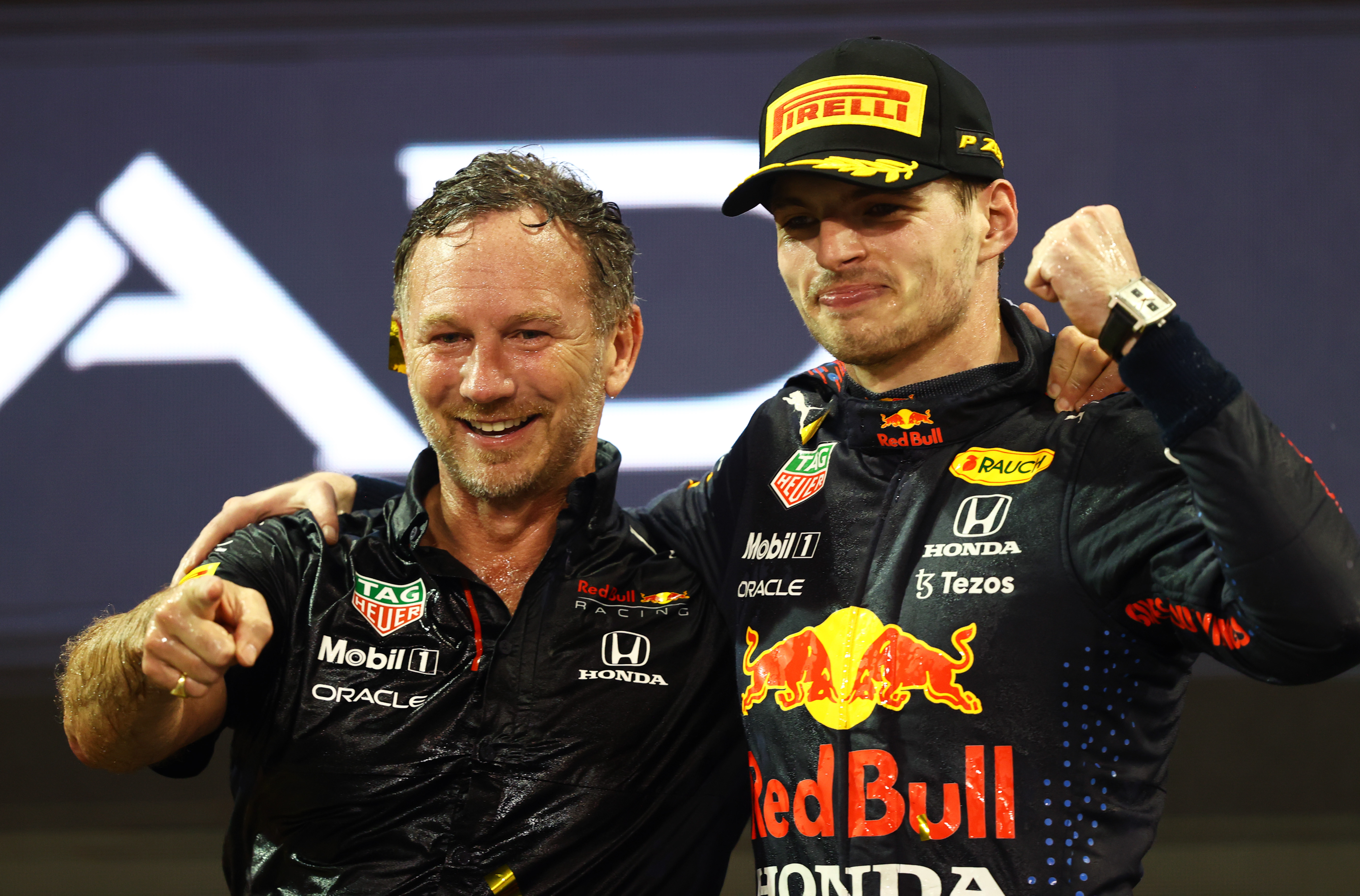 Horner, left, celebrates winning the 2021 F1 World Drivers Championship with driver Max Verstappen at Yas Marina Circuit on December 12, 2021, in Abu Dhabi, United Arab Emirates