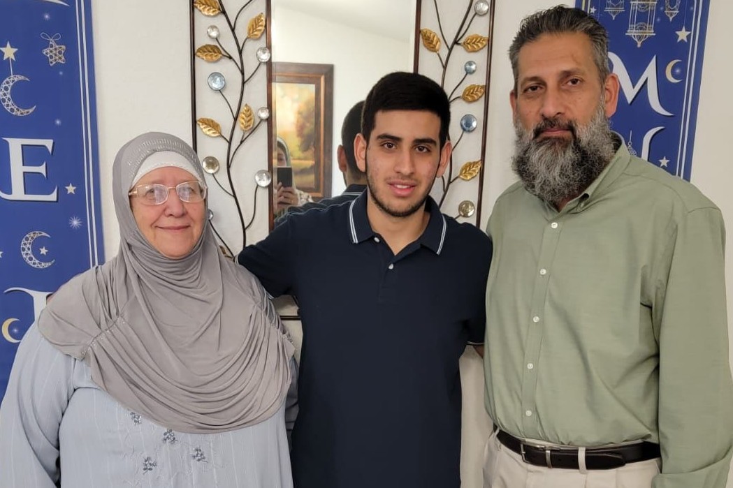 Sayfollah Musallet poses for a family photo with his grandmother and uncle [Photo courtesy of family]