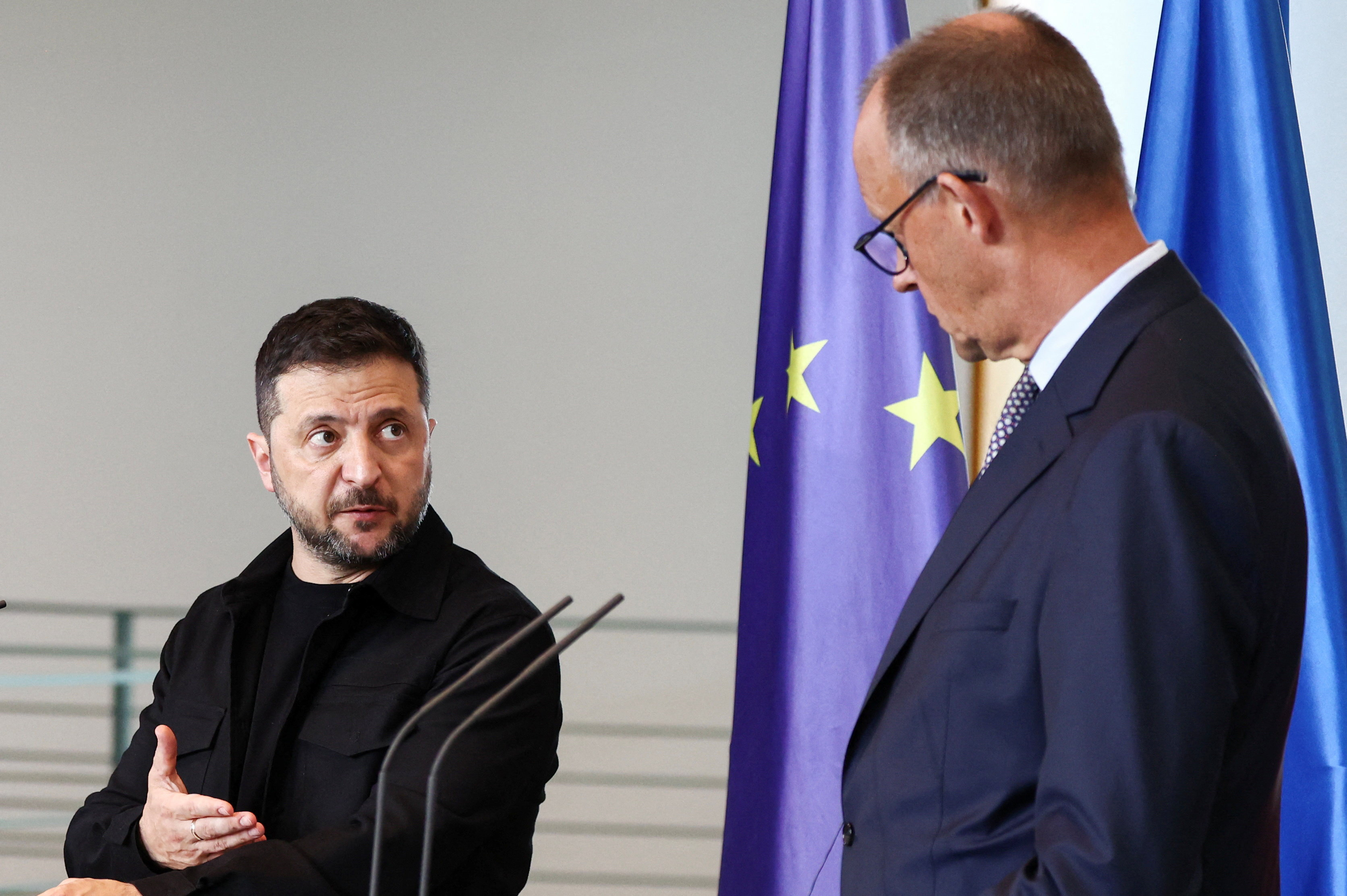German Chancellor Friedrich Merz and Ukrainian President Volodymyr Zelenskiy attend a press conference,