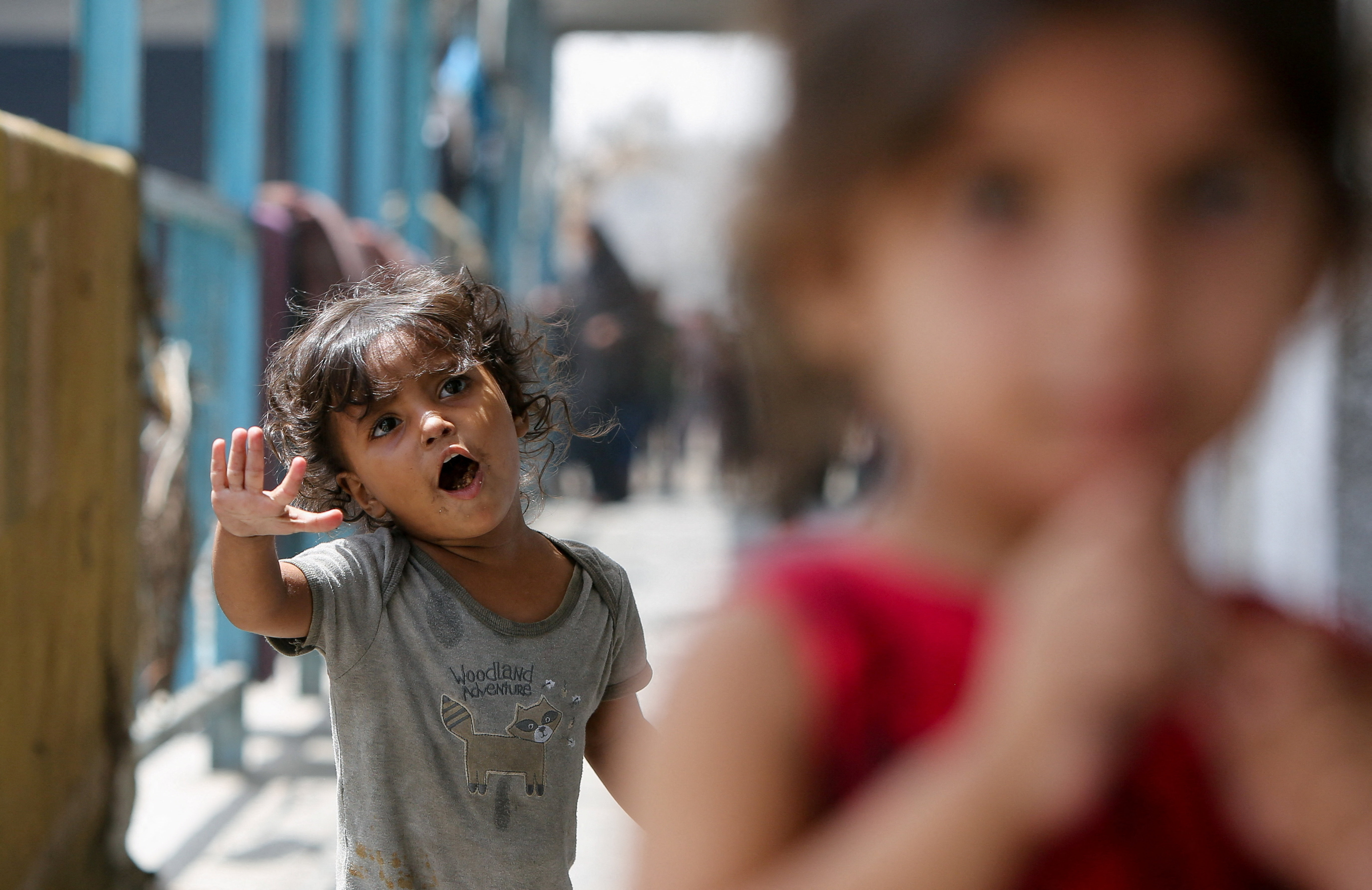 Palestinian children, displaced by the Israeli military offensive, shelter in an UNRWA school, in Khan Younis