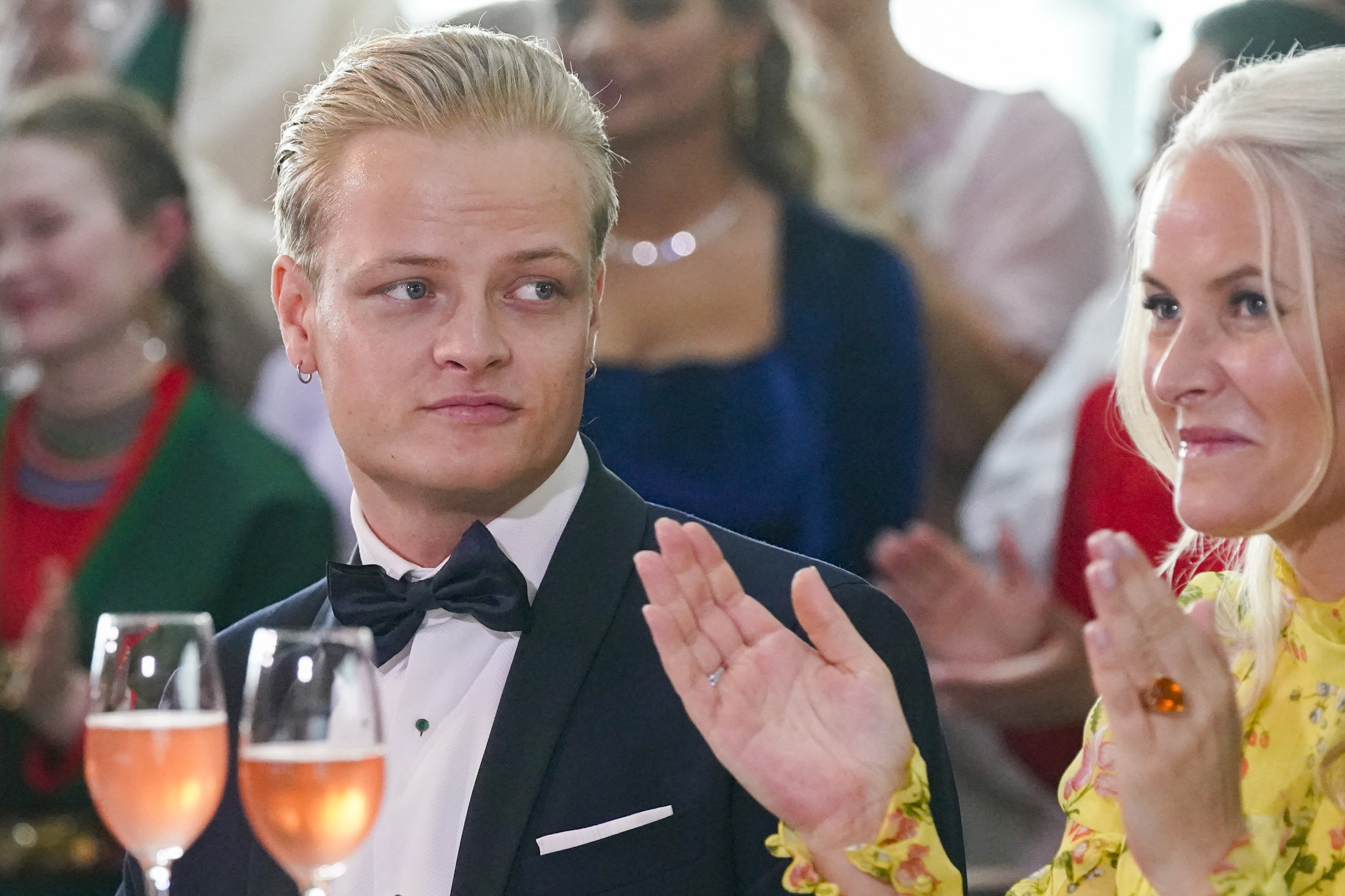Marius Borg Hoiby sitting next to his mother Norwegian Crown Princess Mette-Marit.