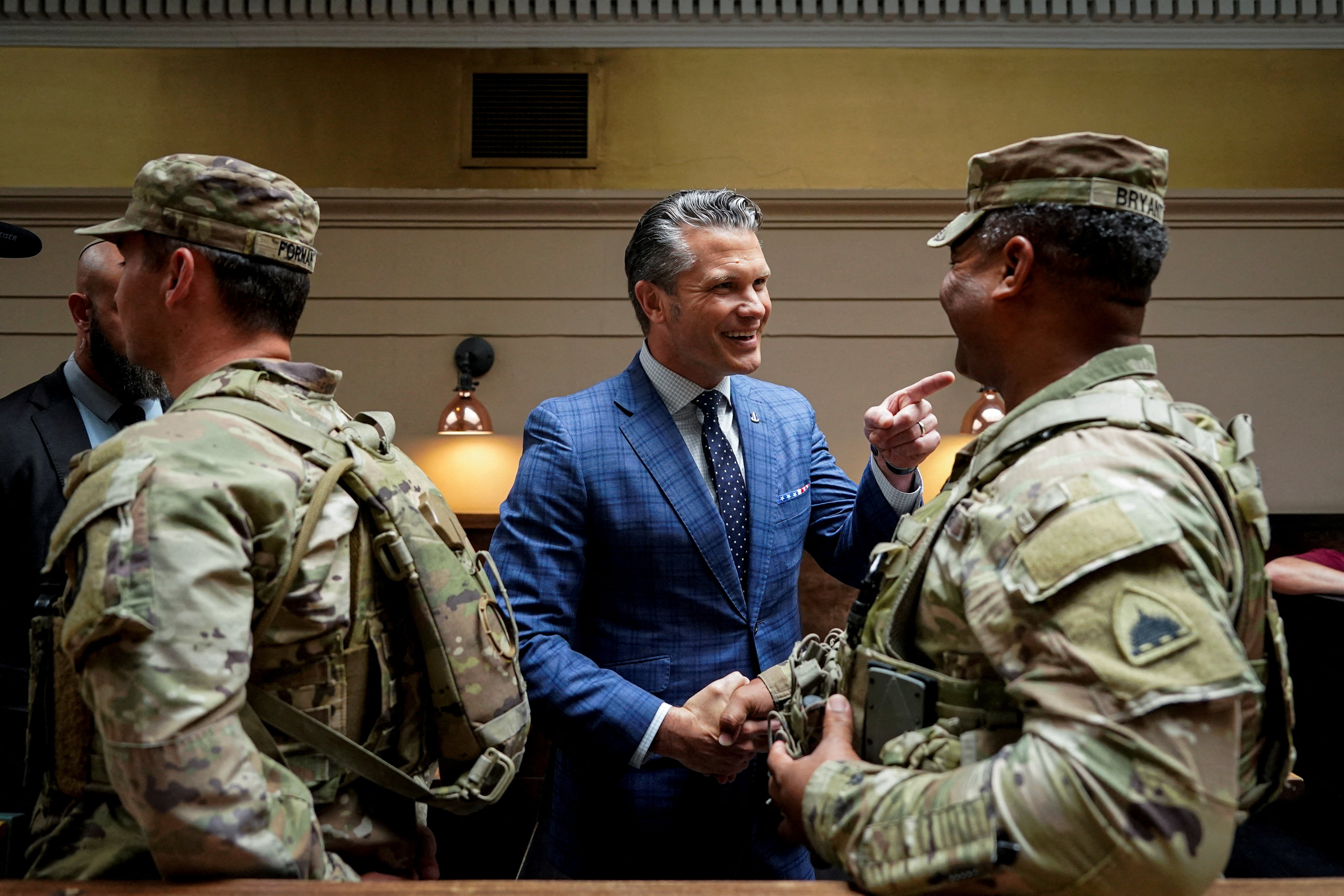 U.S. Defense Secretary Pete Hegseth greets a member of the National Guard, at Union Station in Washington, D.C., U.S., August 20, 2025. REUTERS/Al Drago/Pool