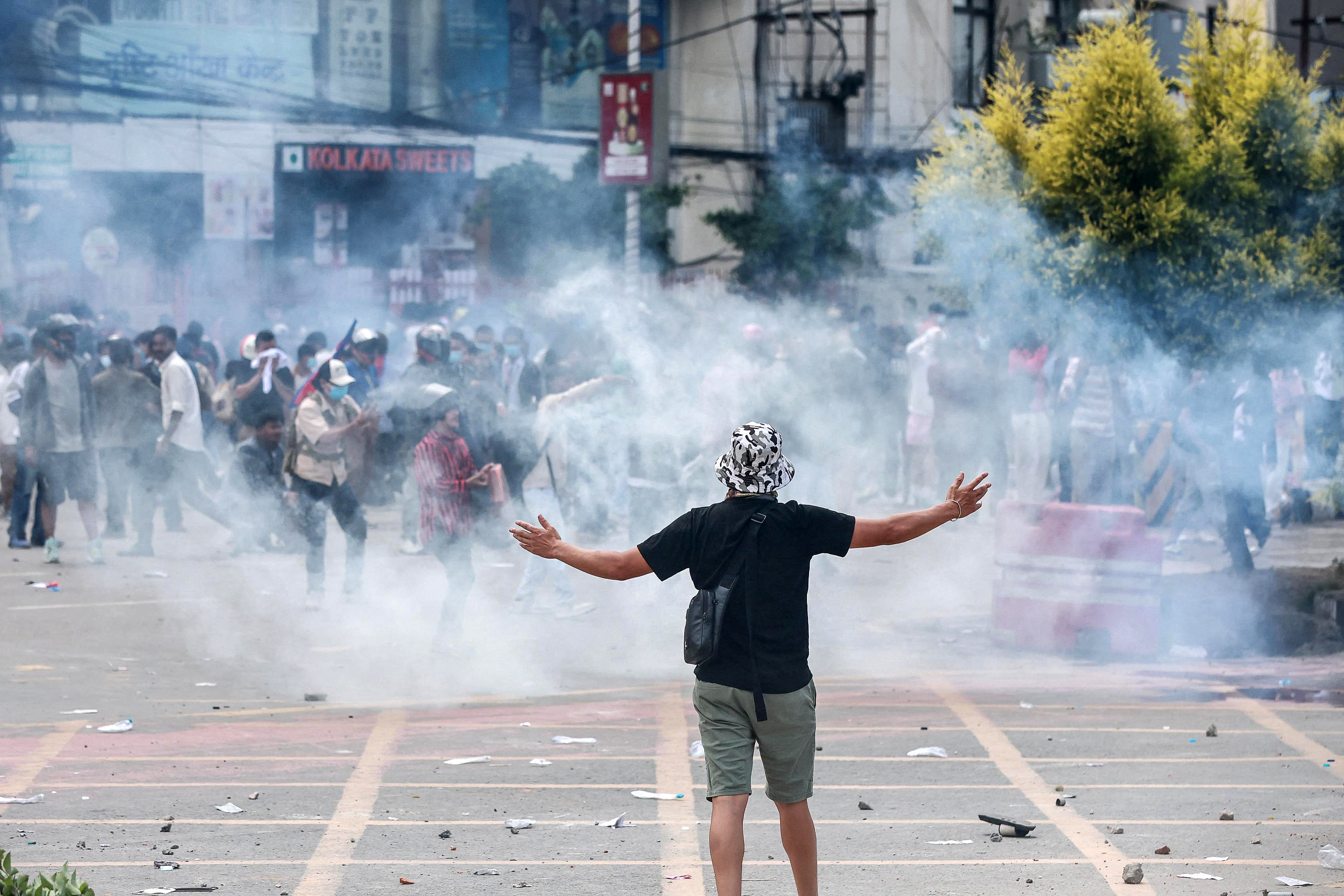 Demonstrators clash with riot police during a protest outside Parliament in Kathmandu condemning social media prohibitions and corruption