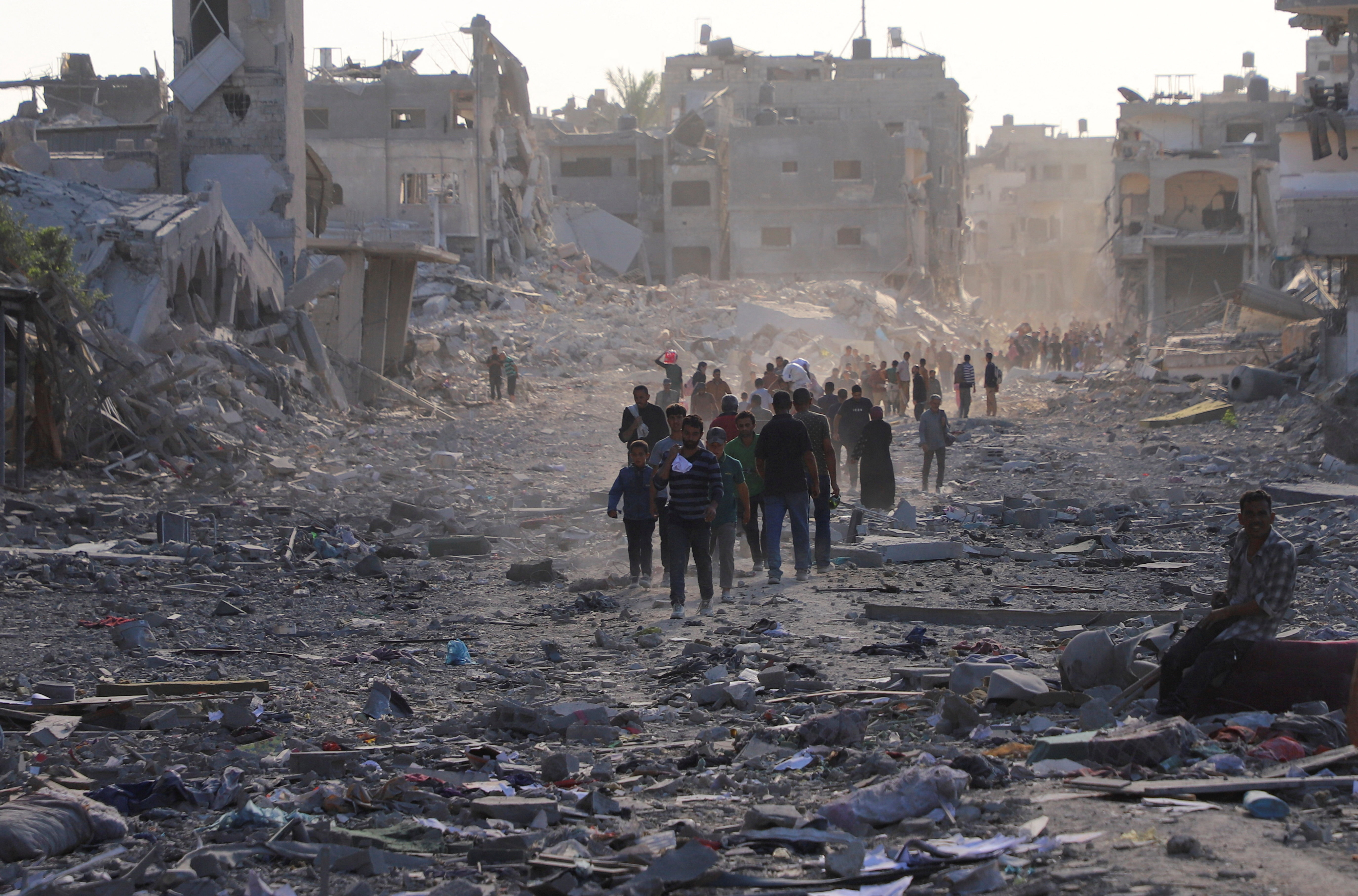 Displaced Palestinians return home as Israel begins Gaza withdrawal