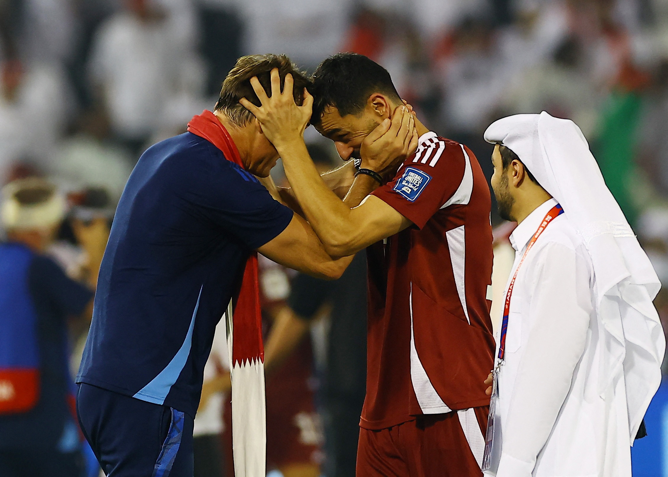 Qatar coach Julen Lopetegui celebrates with Boualem Khoukhi after qualifying for the FIFA World Cup