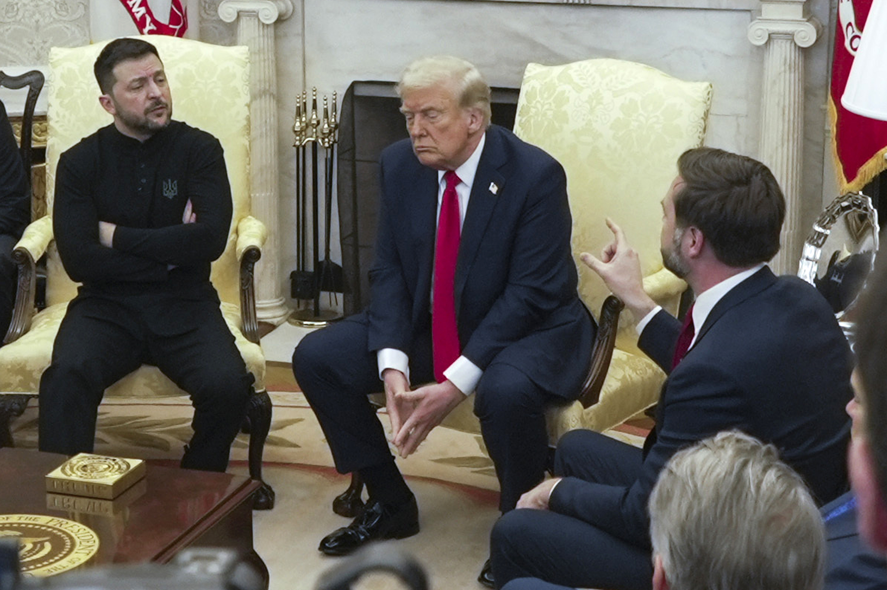 Donald Trump, JD Vance and Volodymyr Zelenskyy, arms folded, in a contentious Oval Office meeting in February 2025