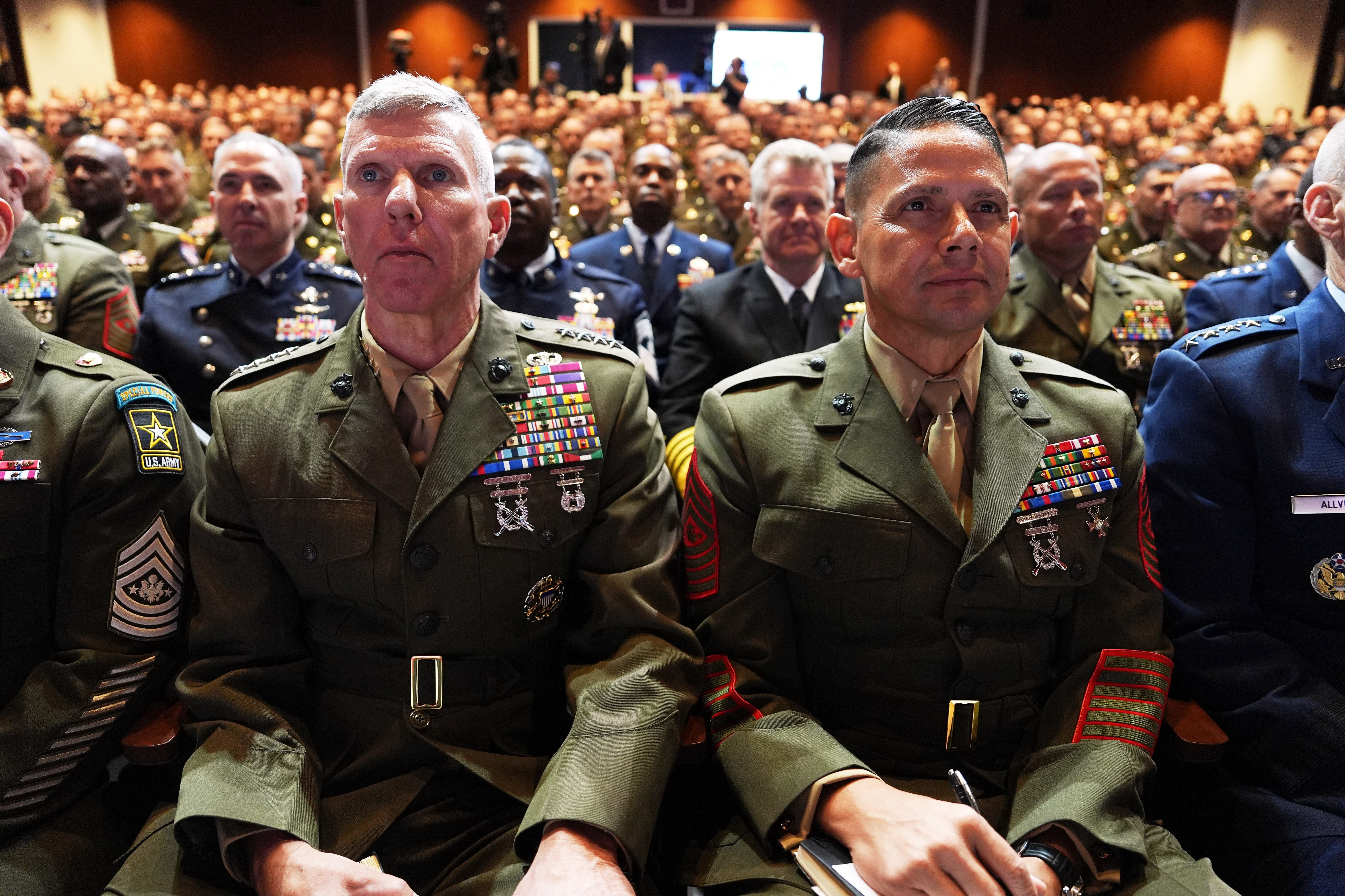 Top military leaders listen to a speech from Trump