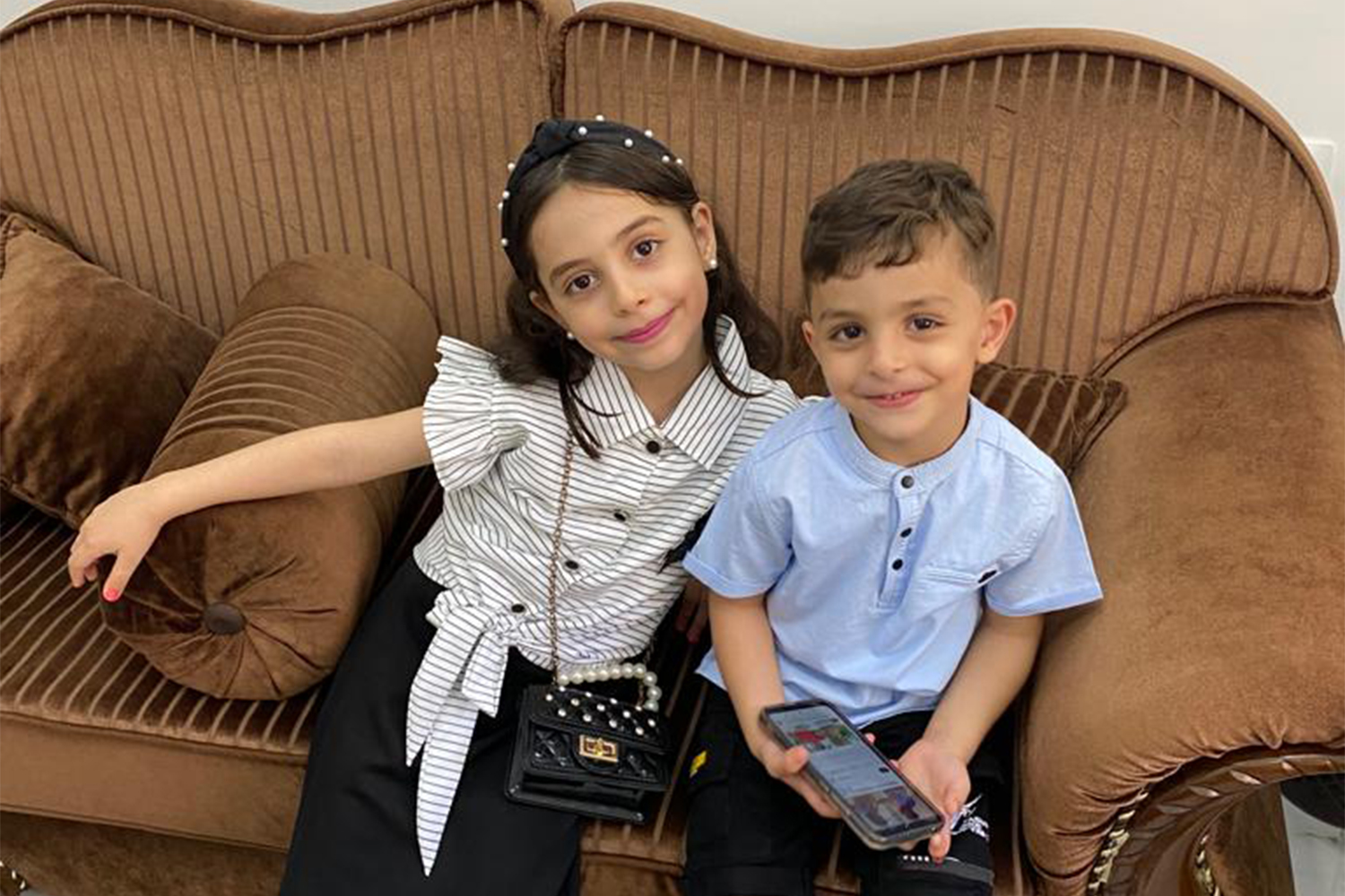 Omar with his older sister, Yasmin, who was six when she was killed by Israel in an airstrike that killed 14 other members of the family in Gaza [Courtesy of Maha Abu Kuwaik]
