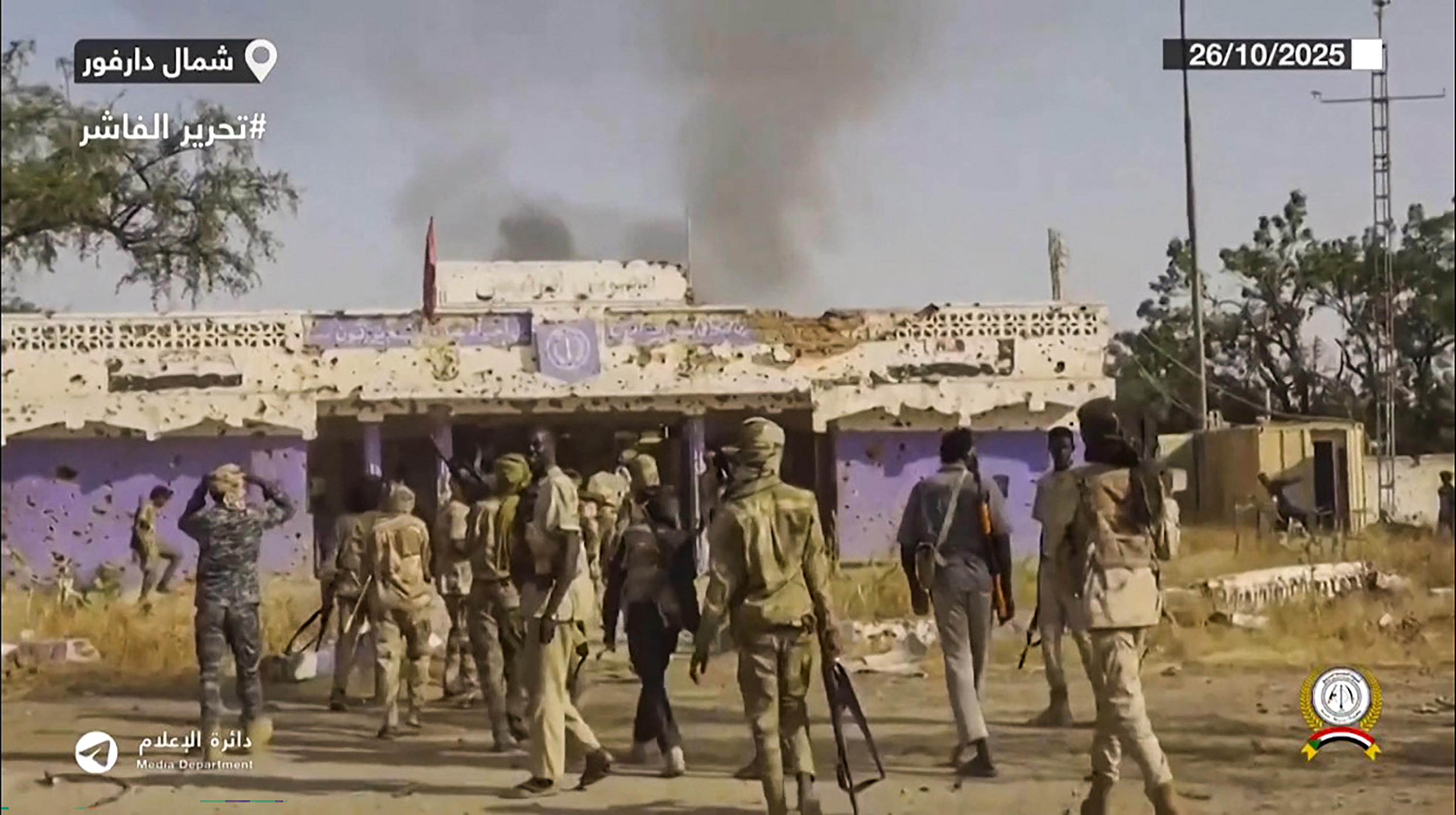 Sudan's RSF fighters celebrate in the streets of el-Fasher in Darfur