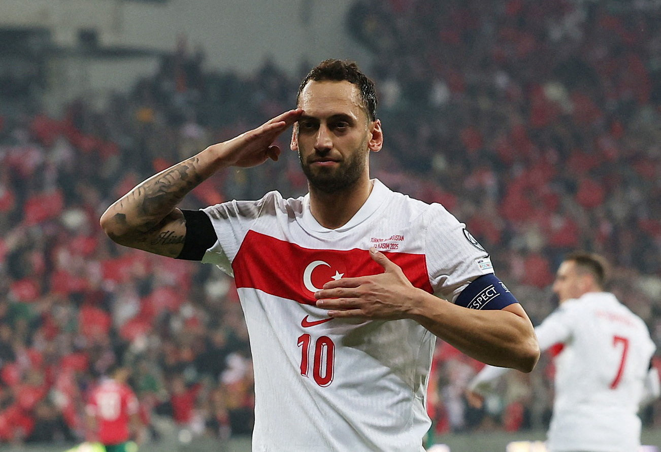 Hakan Calhanoglu reacts.
