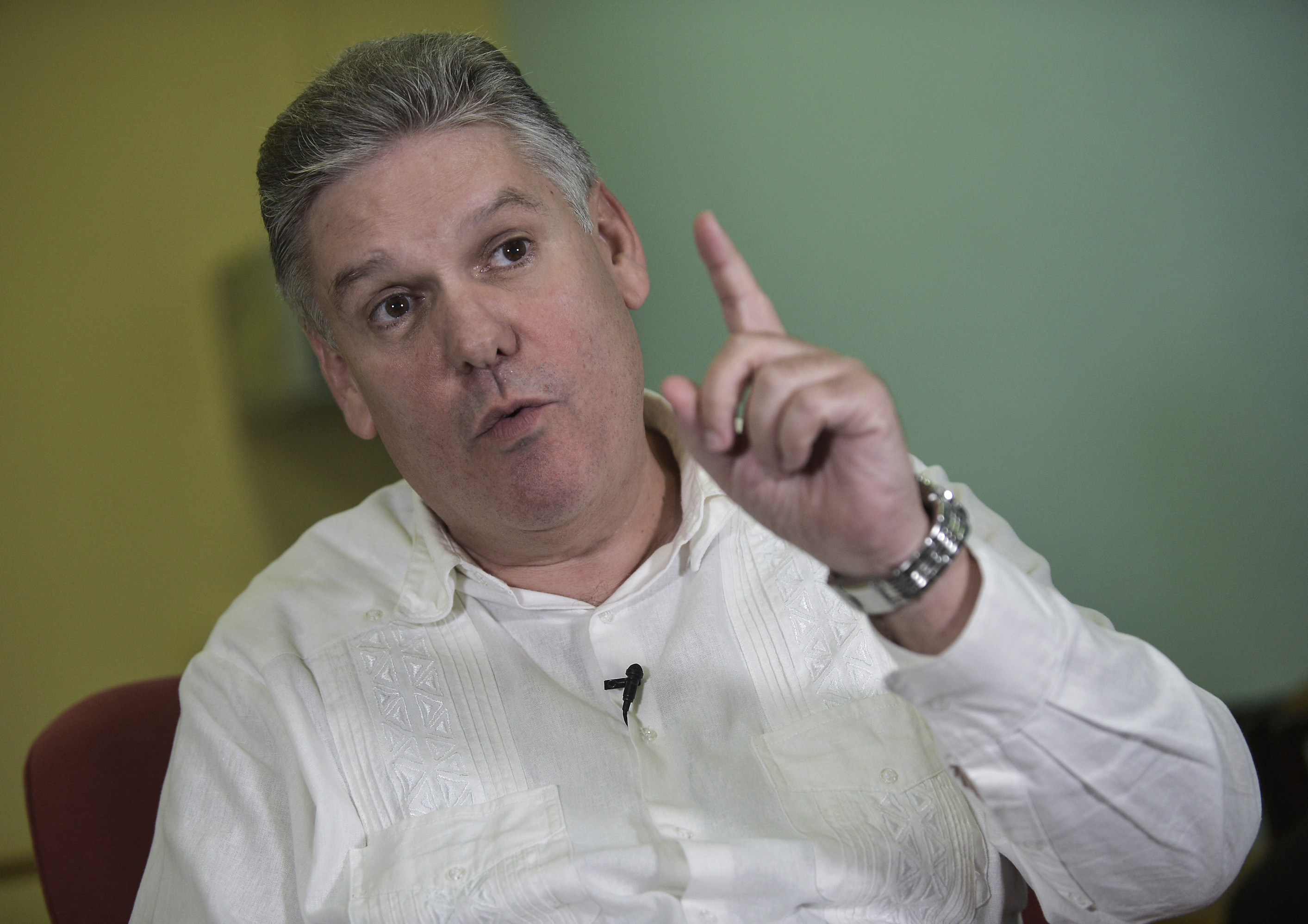 Cuban former Economy Minister Alejandro Gil talks during an interview.