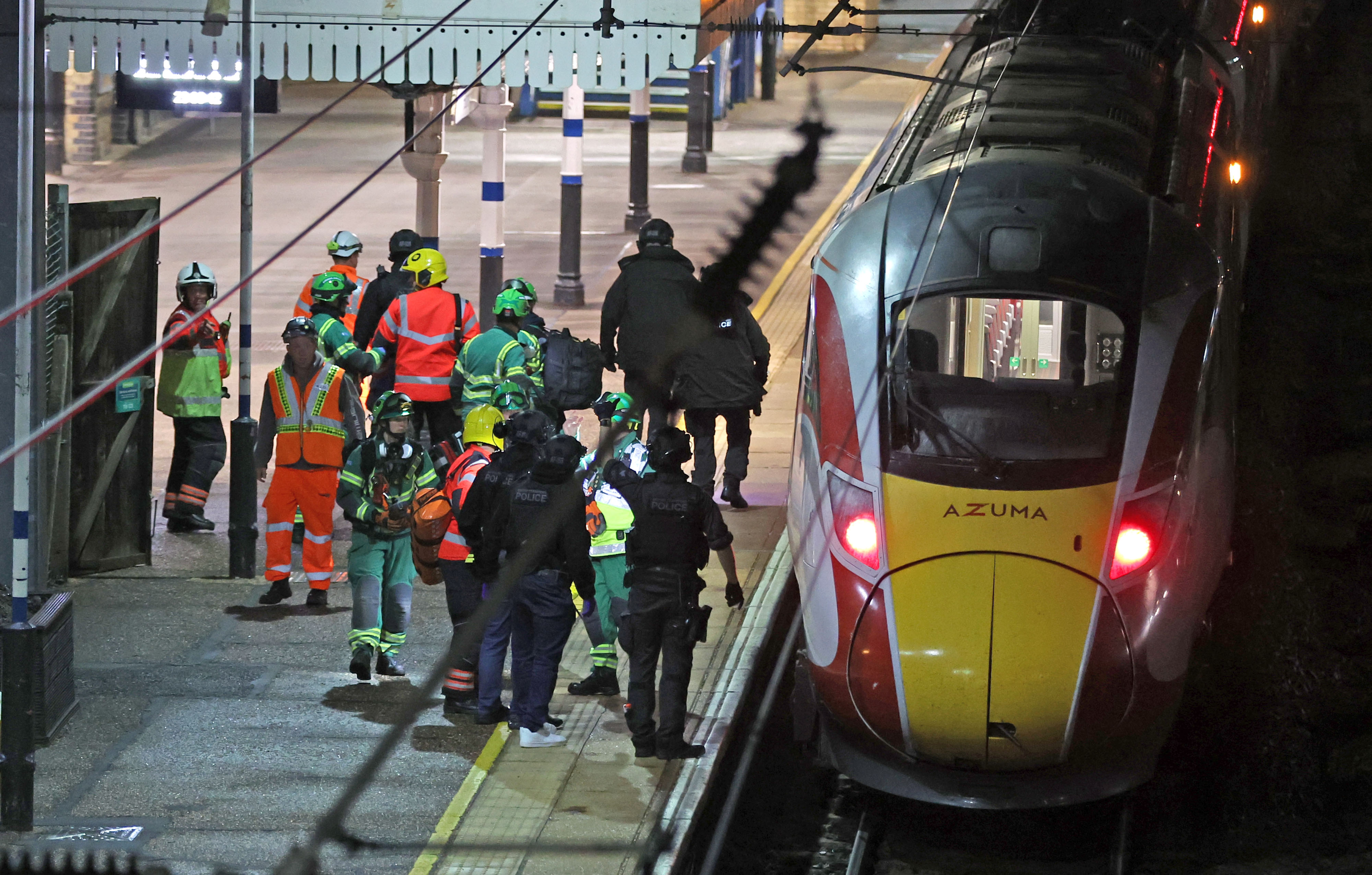 Emergency responders on the platform by the train at Huntingdon.