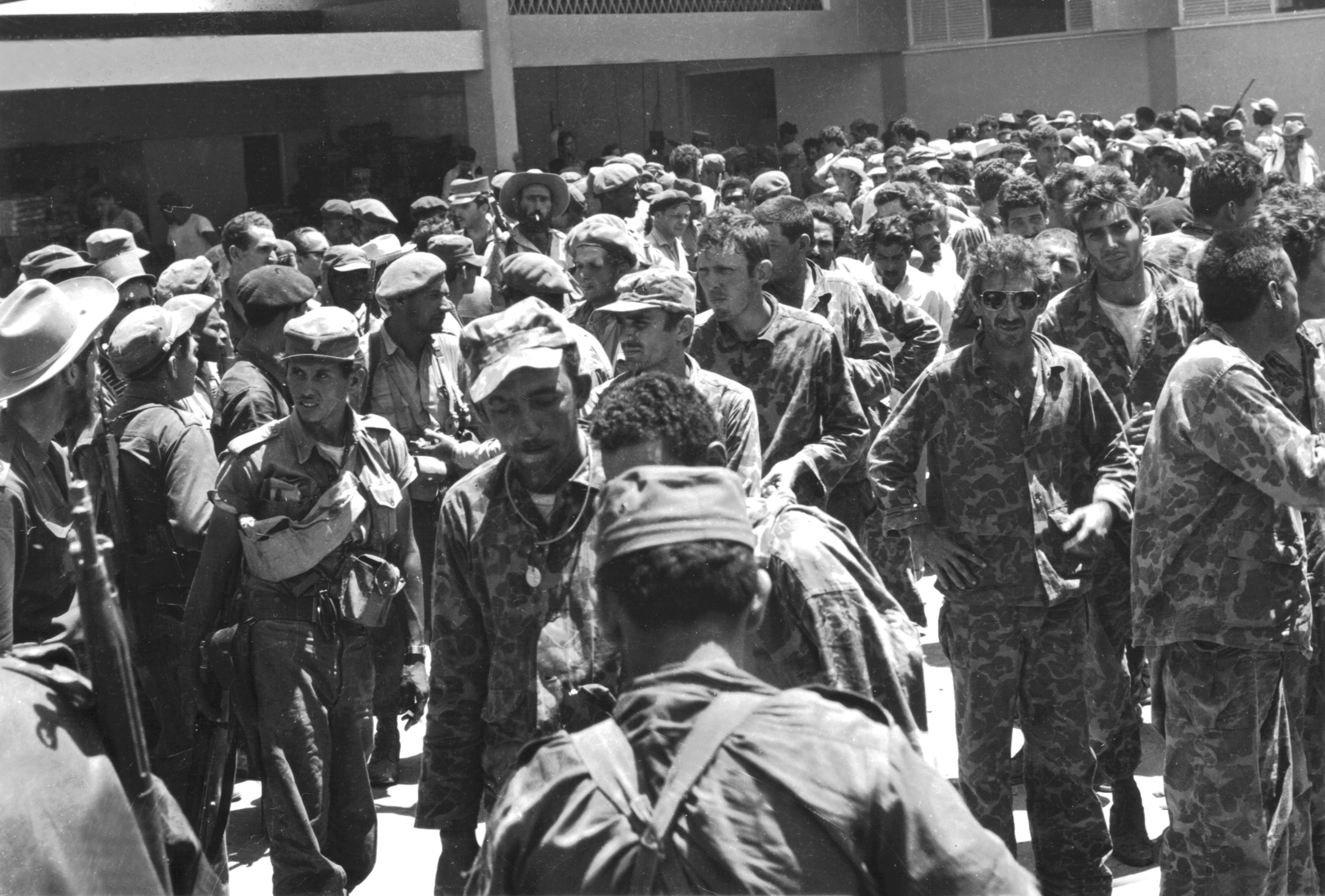 Cuban exiles trained by the US landing at the Bay of Pigs, Cuba – and surrendering – in 1961