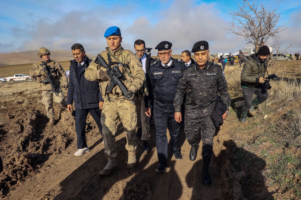 Libyan military delegation members arrive at the wreckage site following the crash of a Libya-bound business jet carrying Libyan Chief of Staff General Muhammad Ali Ahmed Al-Haddad, in Ankara on December 24, 2025. [Adem Altan/AFP]