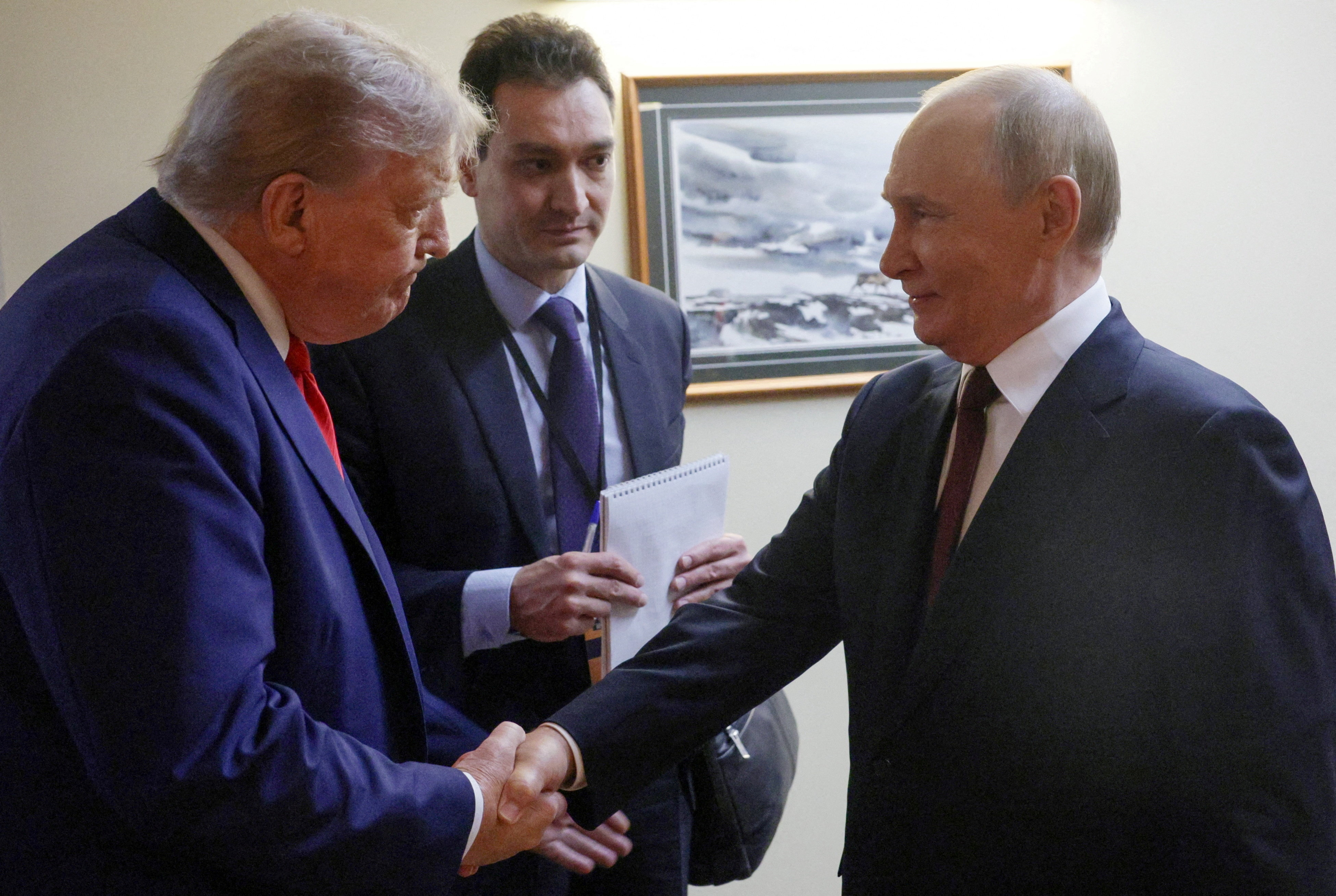 US President Donald Trump shakes hands with Russian President Vladimir Putin before a joint news conference following their meeting at Joint Base Elmendorf-Richardson in Anchorage, Alaska, US, on August 15, 2025