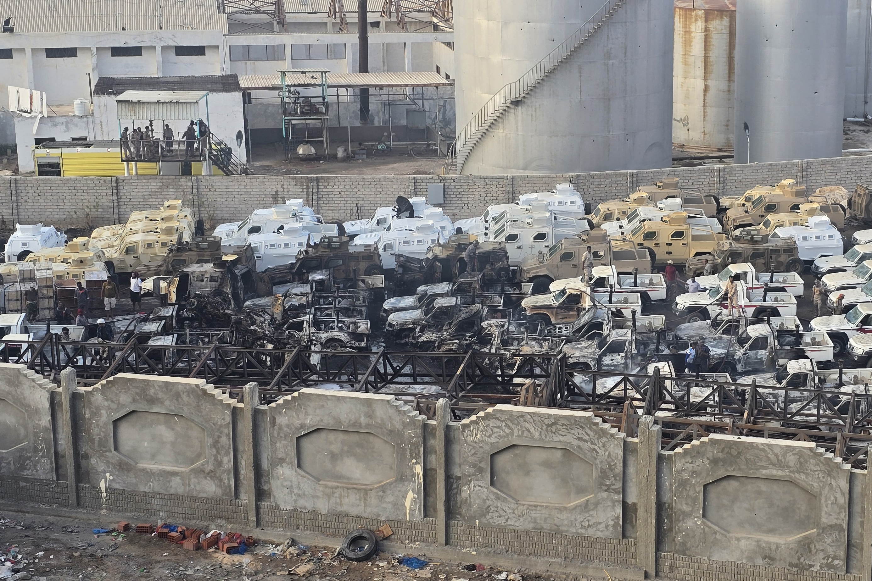 Damaged military vehicles, reportedly sent by the UAE to support Southern Transitional Council separatist forces, following an air strike by the Saudi-led coalition in the port of Mukalla