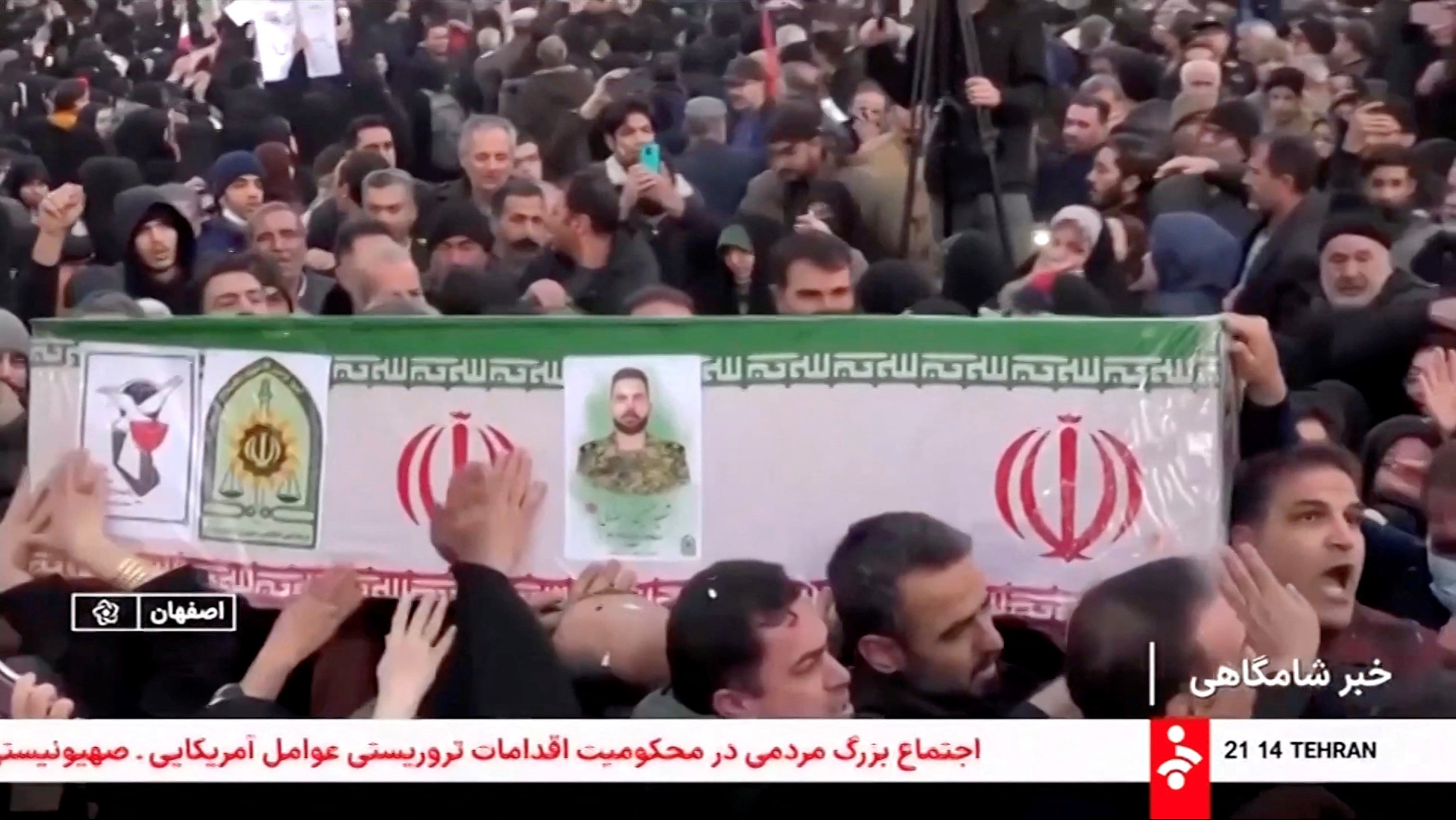 Mourners carry a coffin during a funeral procession for members of security forces and civilians said to be killed in protests on Sunday.