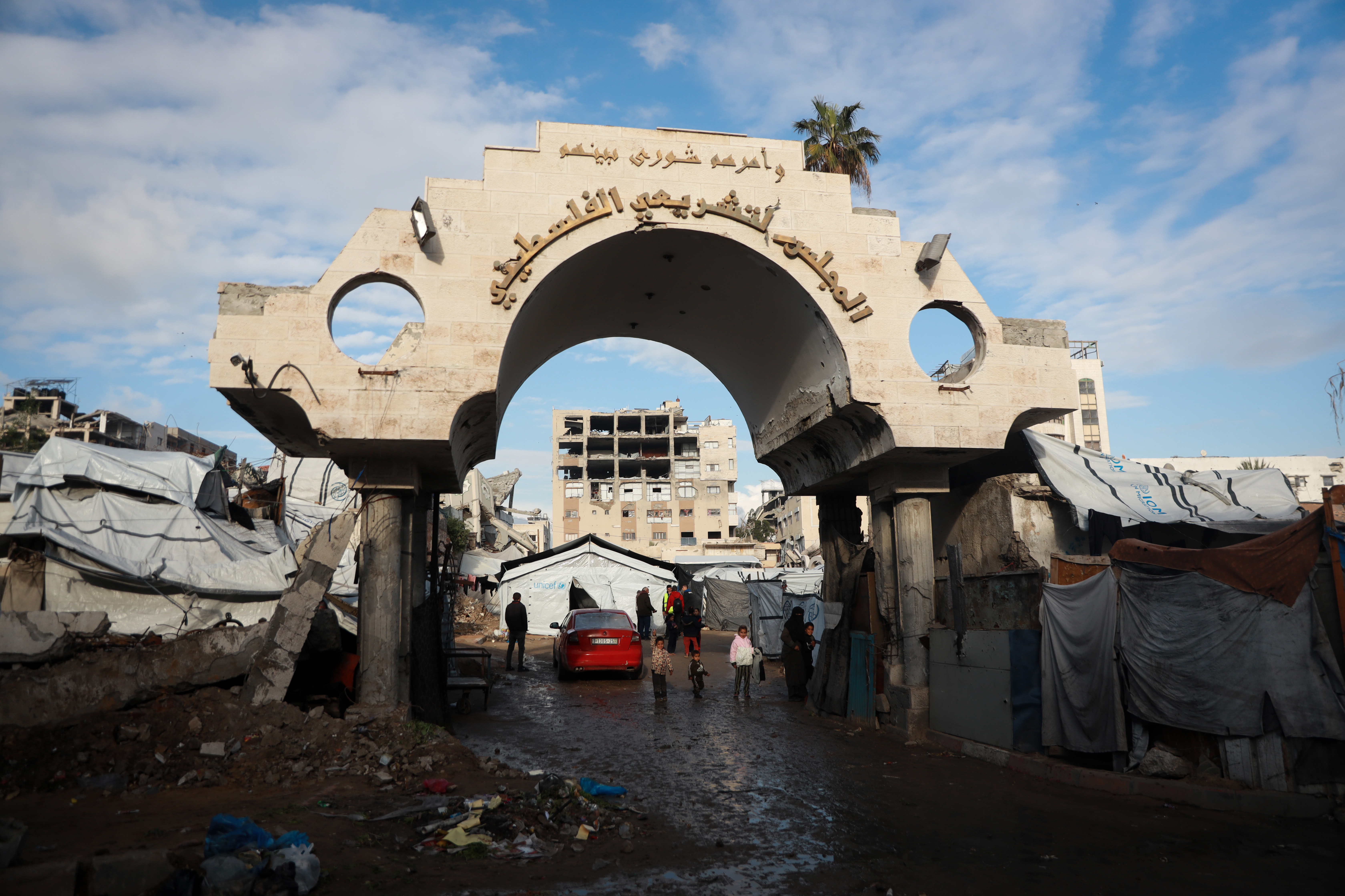 Palestinians use what remains of the Gaza Legislative Council building in Gaza City for shelter